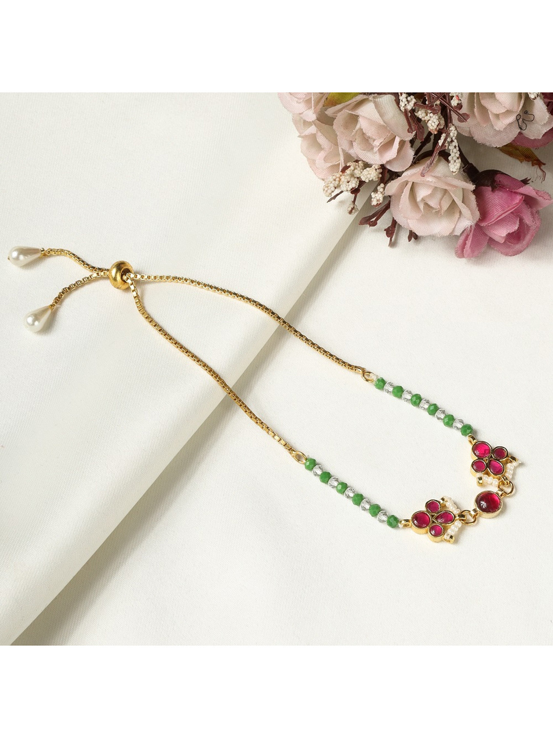 

AURAA TRENDS Women 22K Gold Plated Red & Green Kundan Beaded Bracelet Rakhi
