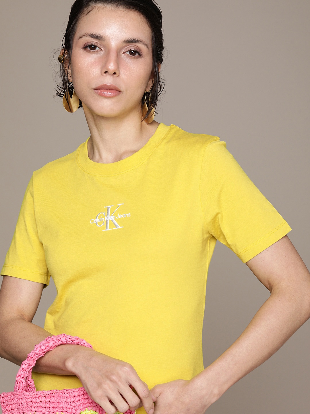 

Calvin Klein Jeans Women Yellow Brand Logo Slim Fit Pure Cotton Casual T-shirt