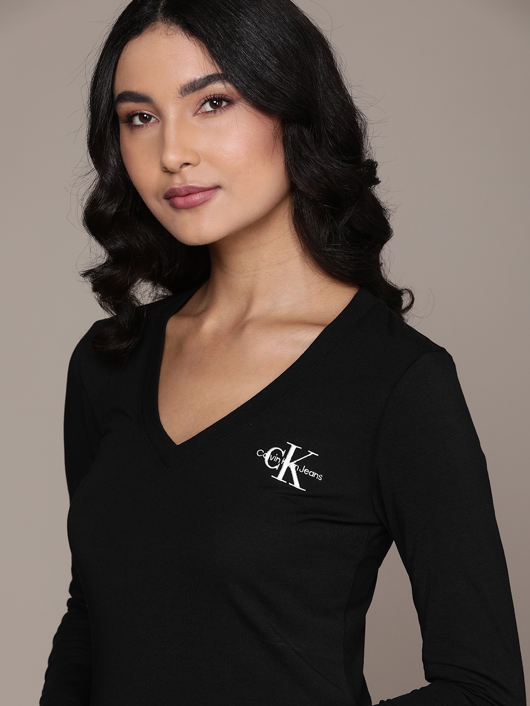 

Calvin Klein Jeans Women Black Solid V-Neck Slim Fit T-shirt