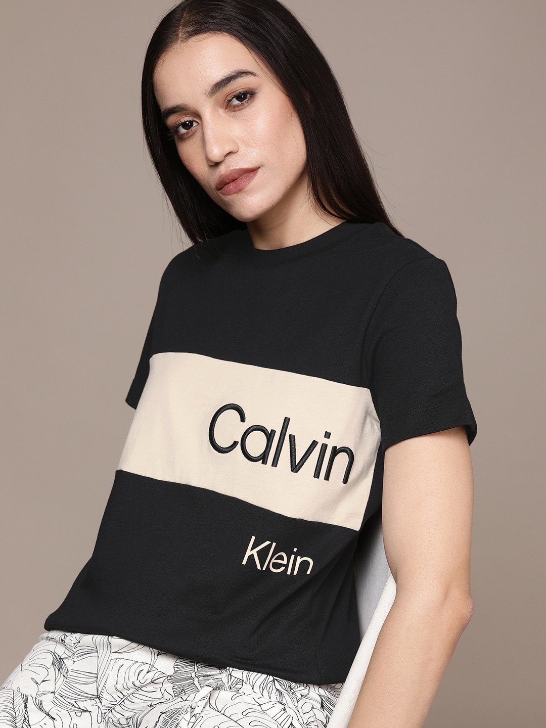 

Calvin Klein Jeans Women Black & Off White Pure Cotton Brand Logo Colourblocked T-shirt