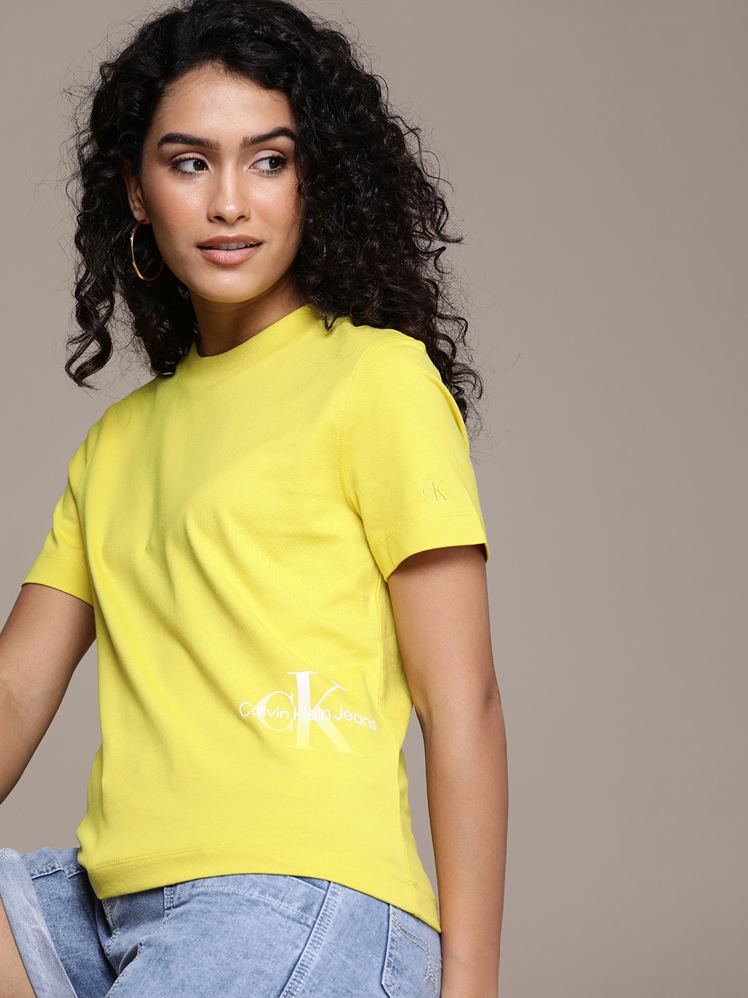 

Calvin Klein Jeans Women Yellow Brand Logo Printed Pure Cotton T-shirt