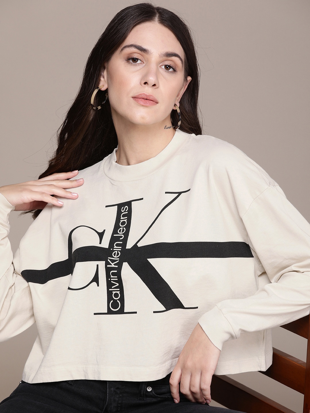 

Calvin Klein Jeans Women Off White & Black Typography Printed Drop-Shoulder Sleeves Pure Cotton Compression T-shirt