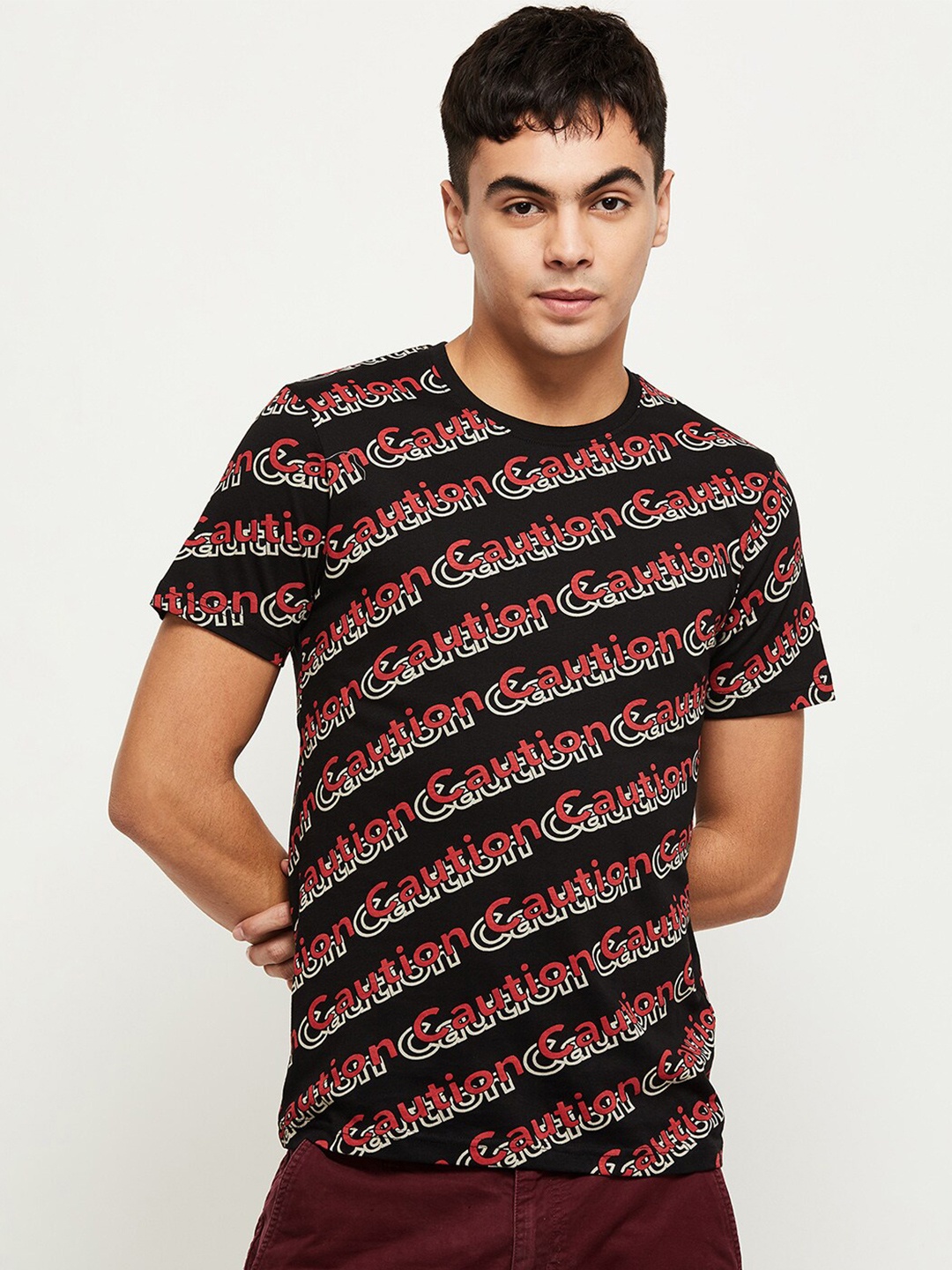 

max Men Black Typography Printed Round Neck T-shirt