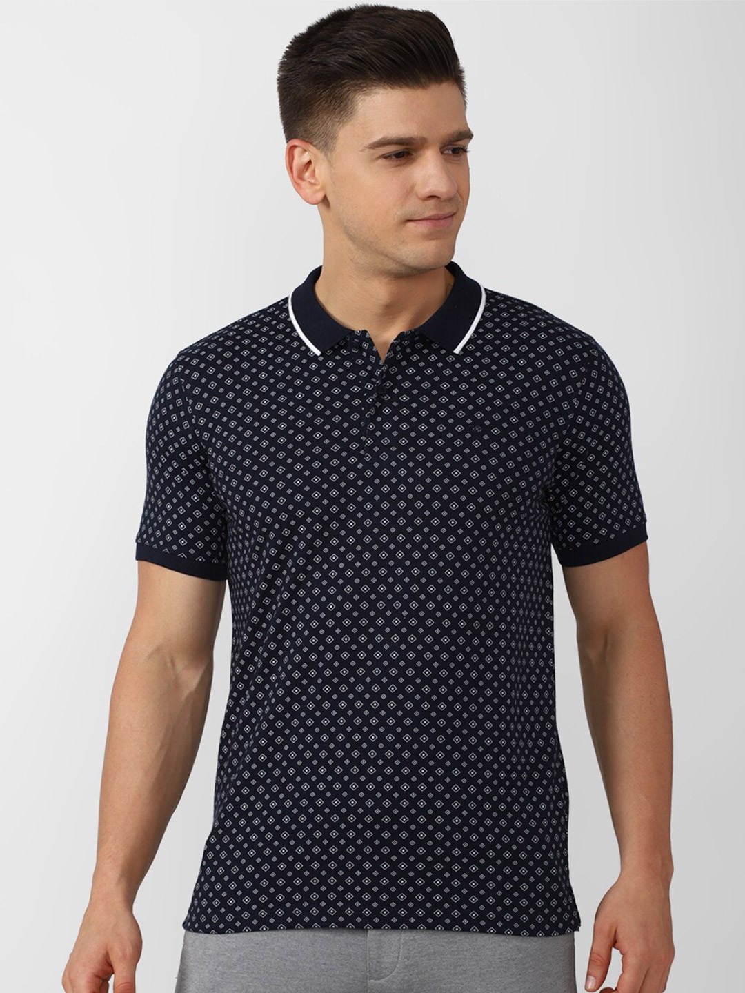 

Peter England Casuals Men Navy Blue Printed Polo Collar T-shirt