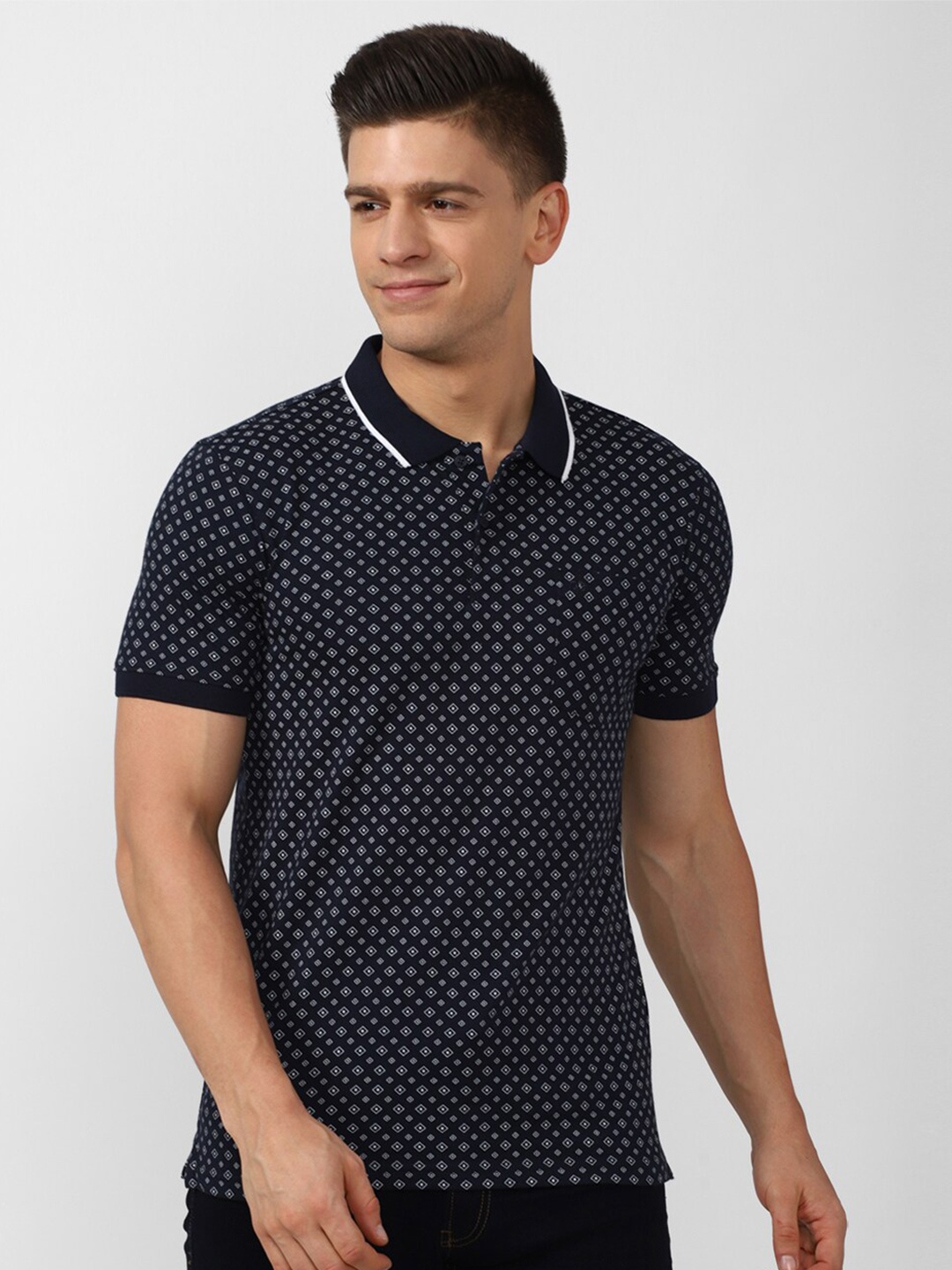 

Peter England Casuals Men Navy Blue Printed Polo Collar T-shirt