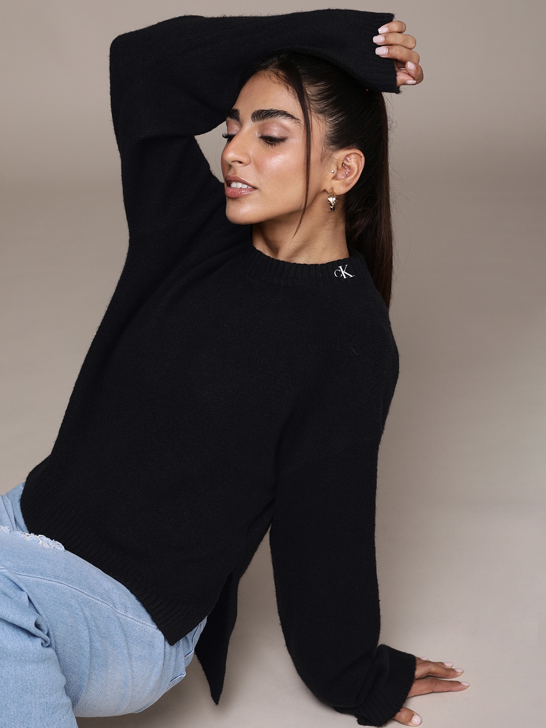 

Calvin Klein Jeans Women Black Solid Fluffy Wide Open Sleeves Pullover With Side Slits
