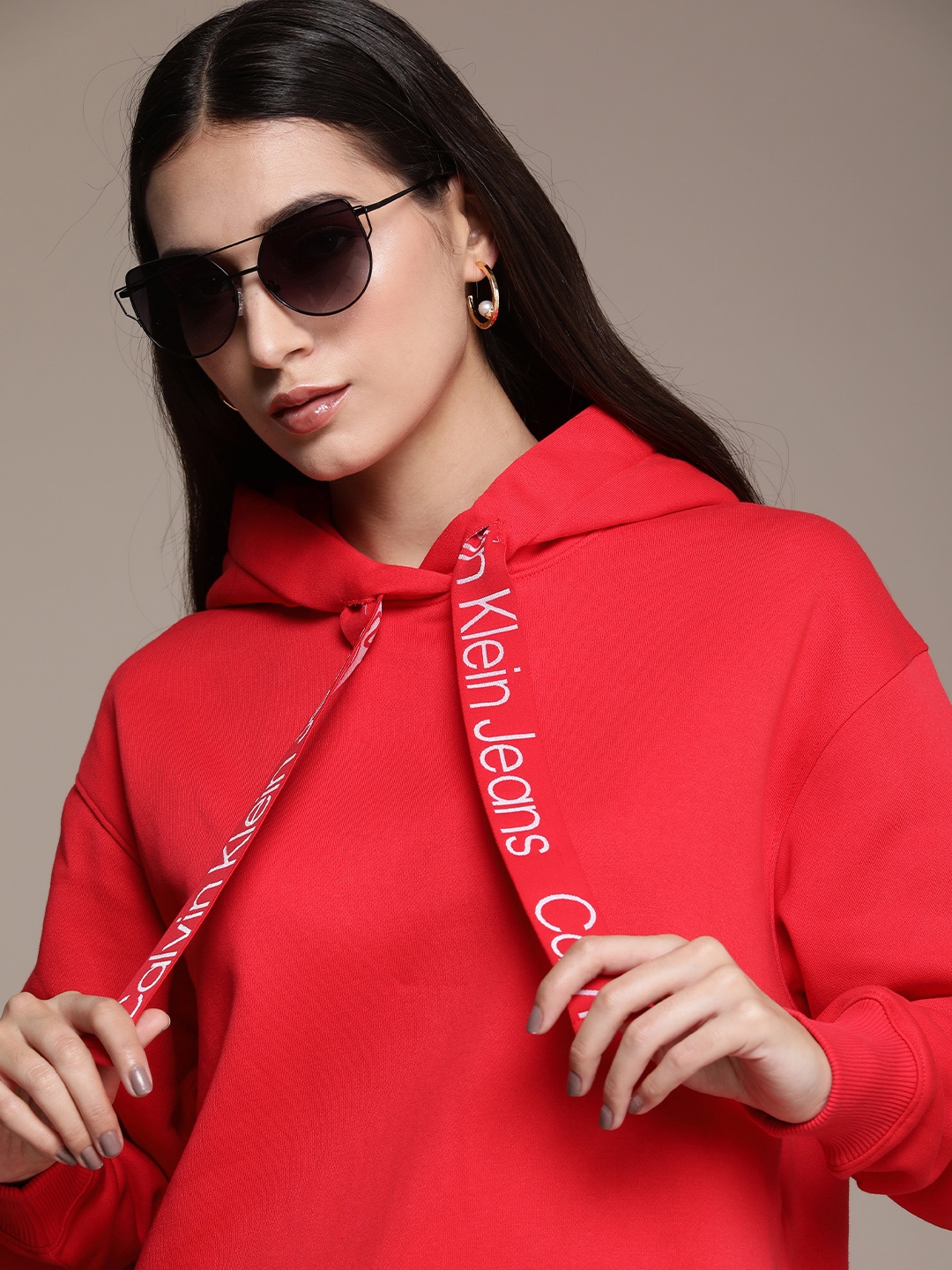 

Calvin Klein Jeans Women Hooded Sweatshirt with Contrast Typography Drawcords, Red