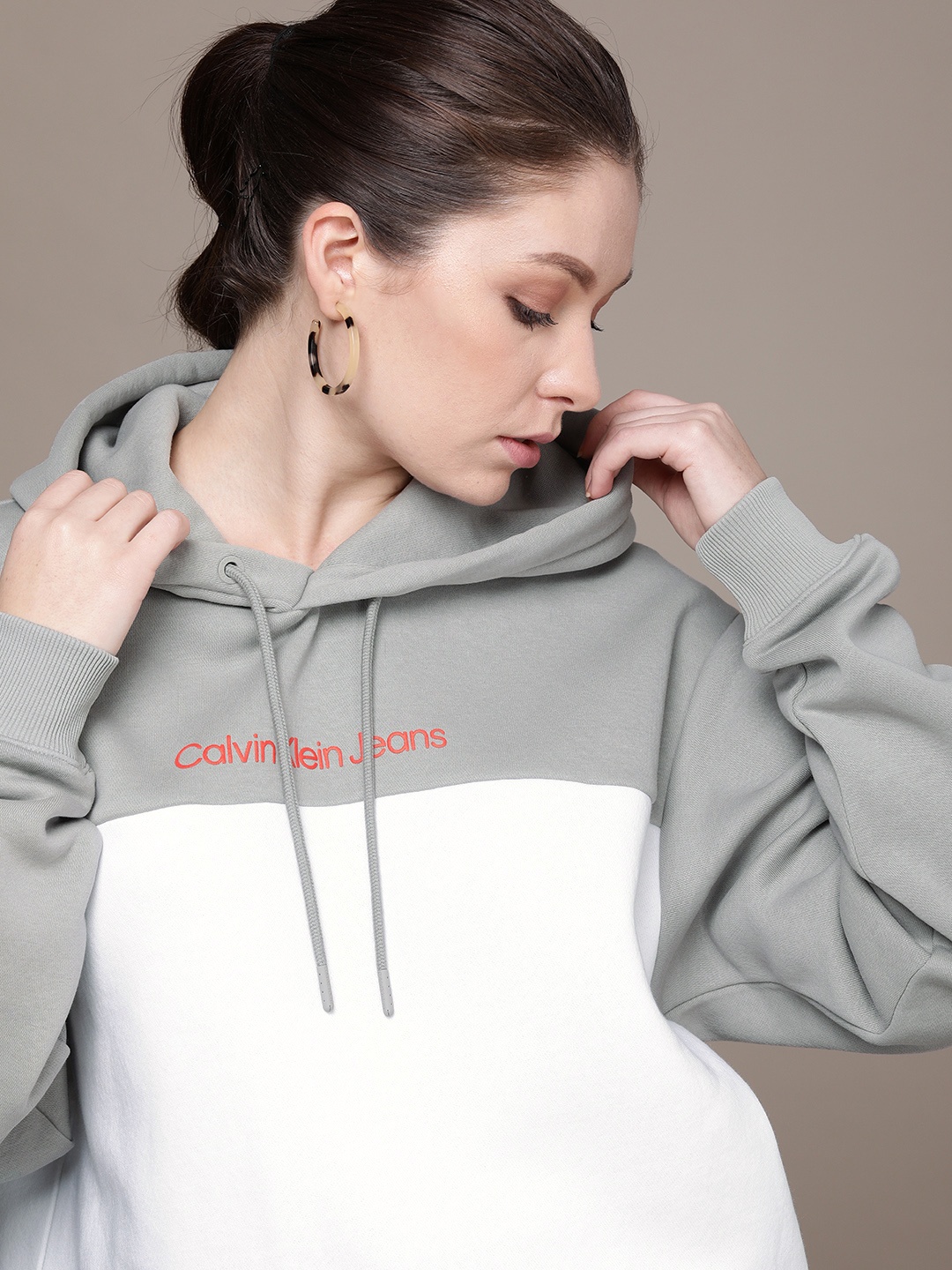 

Calvin Klein Jeans Women Grey And White Colourblocked Hooded Sweatshirt