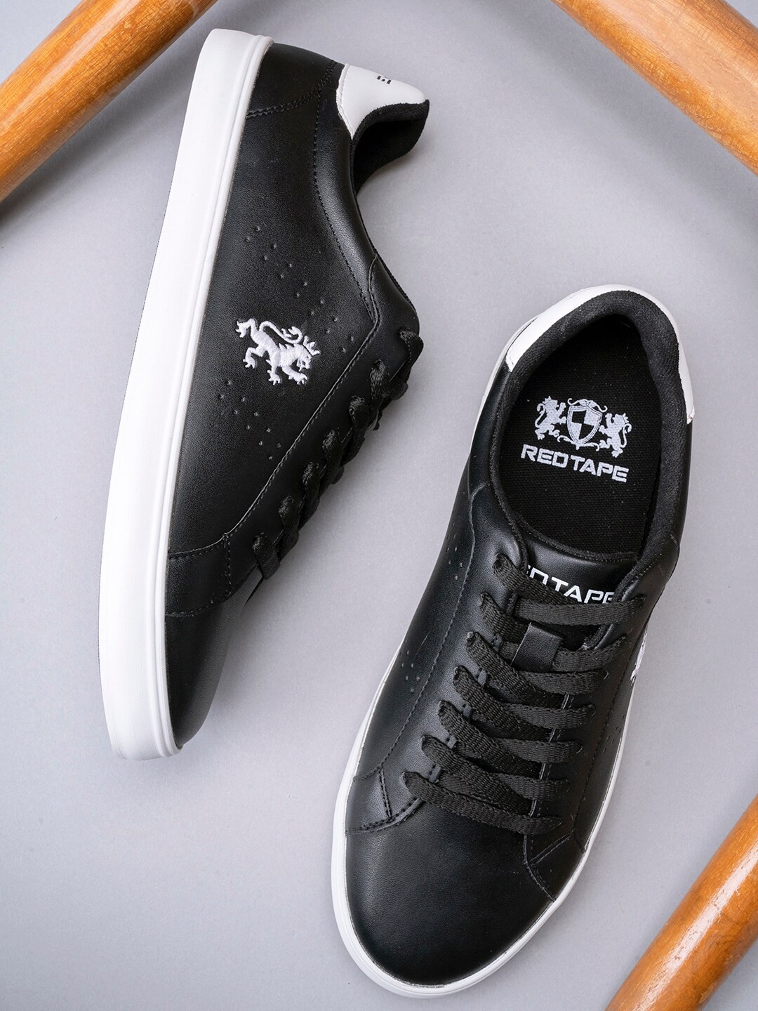 

Red Tape Women Black Perforations Sneakers