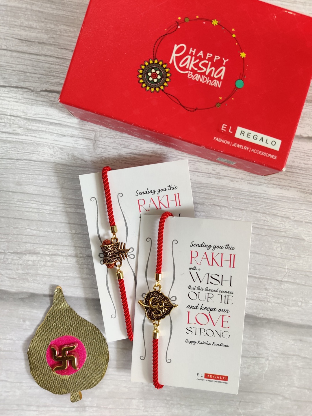 

EL REGALO Bhaiya Bhabhi Red Gold-Toned Set of 2 Rakhi with Roli Chawal Card