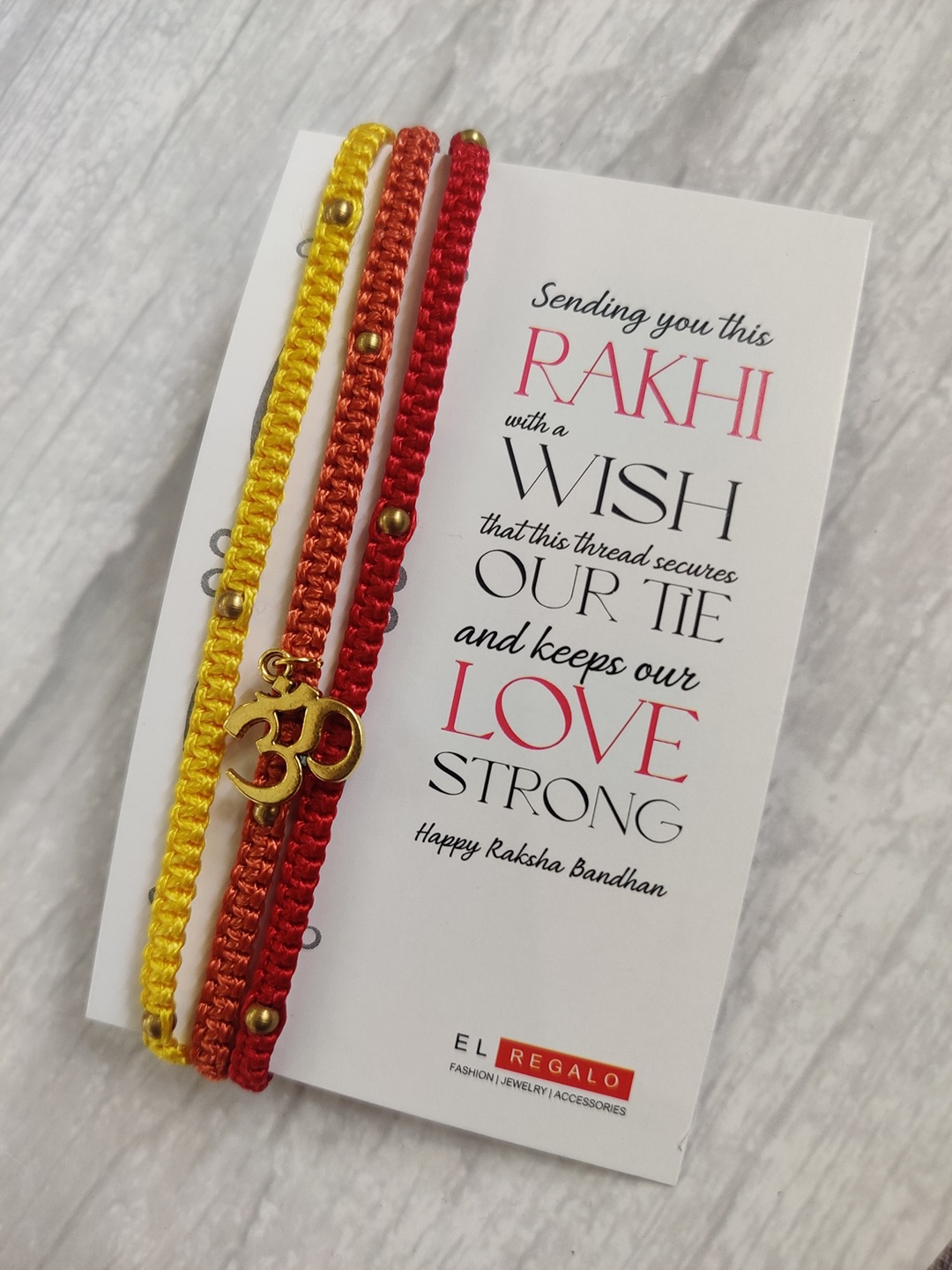 

EL REGALO Men Red & Gold-Colored Om-Studded Rakhi