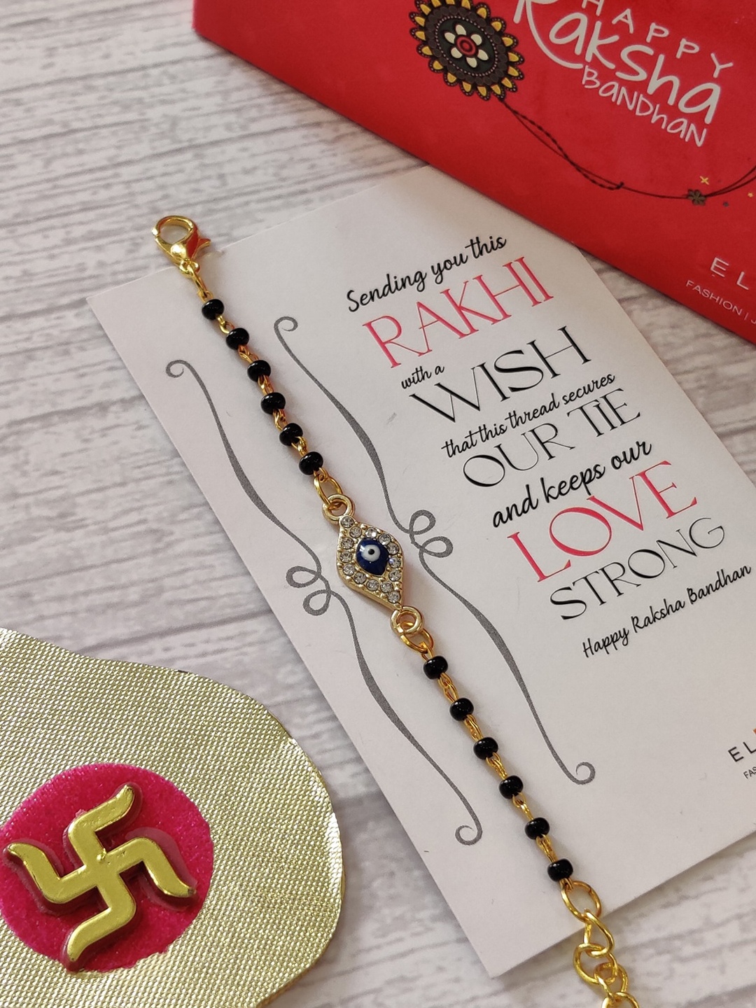 

EL REGALO Kids Gold-Plated Nazaria Rakhi With Greeting Card & Roli Chawal Shagun