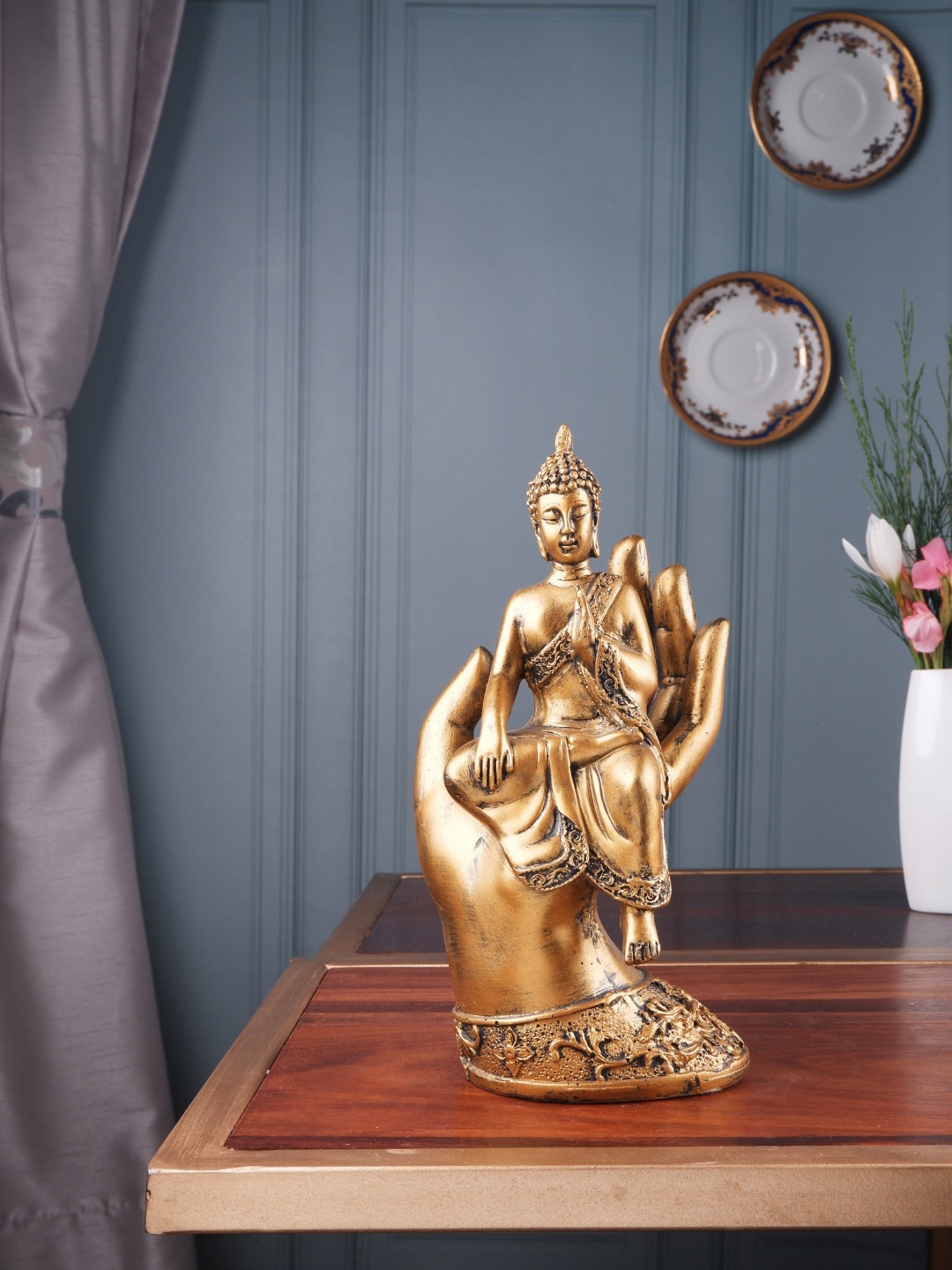 

THE WHITE INK DECOR Gold-Colored Buddha Sitting on Palm Figurine Showpieces