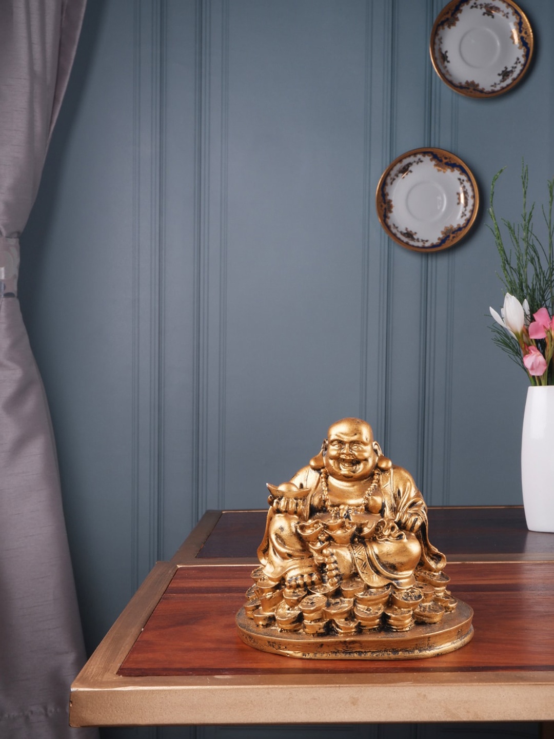 

THE WHITE INK DECOR Gold-Toned Solid Laughing Buddha Sitting On Coins Showpiece