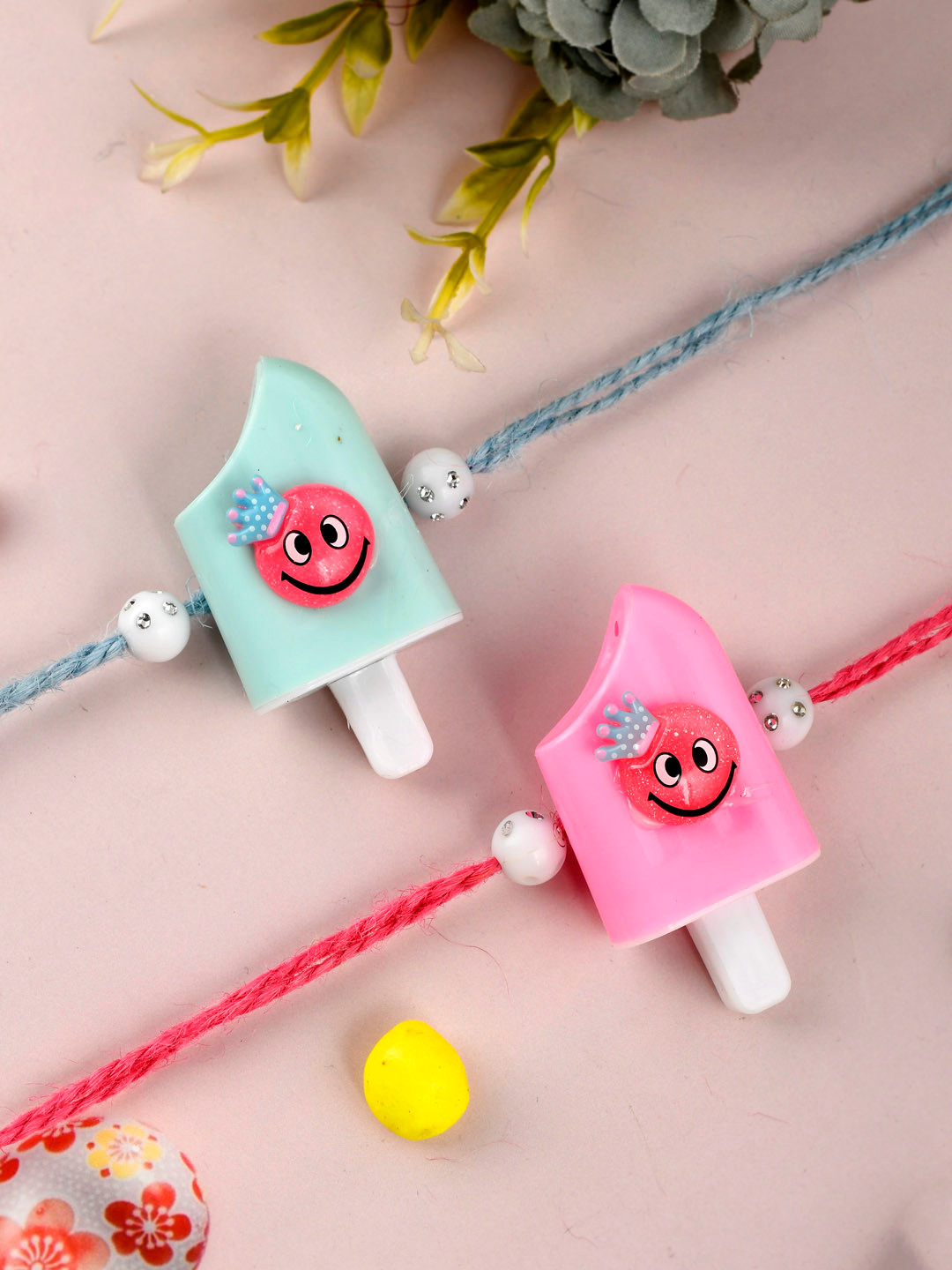 

Shoshaa Unisex Kids Set of 2 Pink & Blue Ice-cream Shaped Rakhi With Roli & Chawal