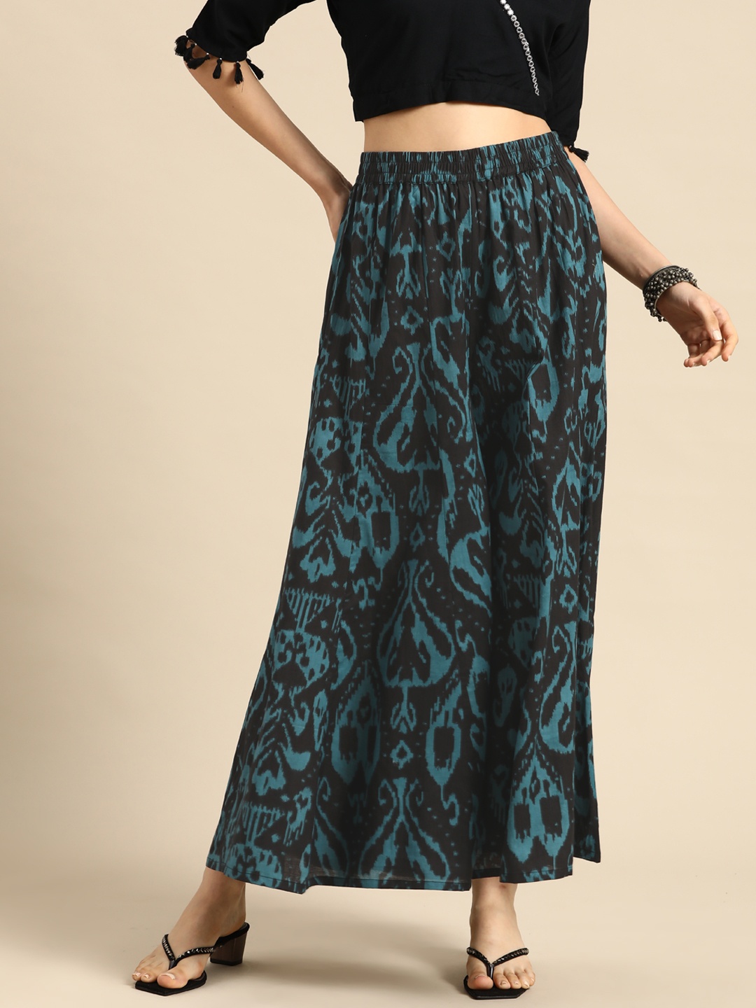 

Sangria Women Black & Teal Printed Flared Cotton Palazzos