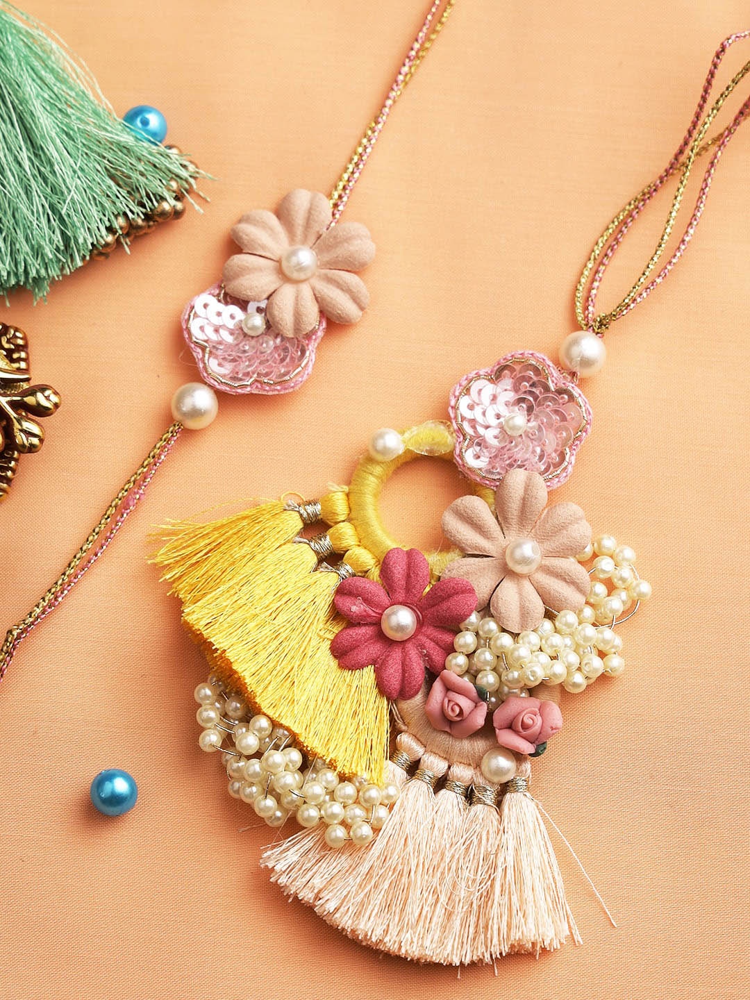 

Aapno Rajasthan Peach & Yellow Sequinned Bhaiya Bhabhi Rakhi Combo Set