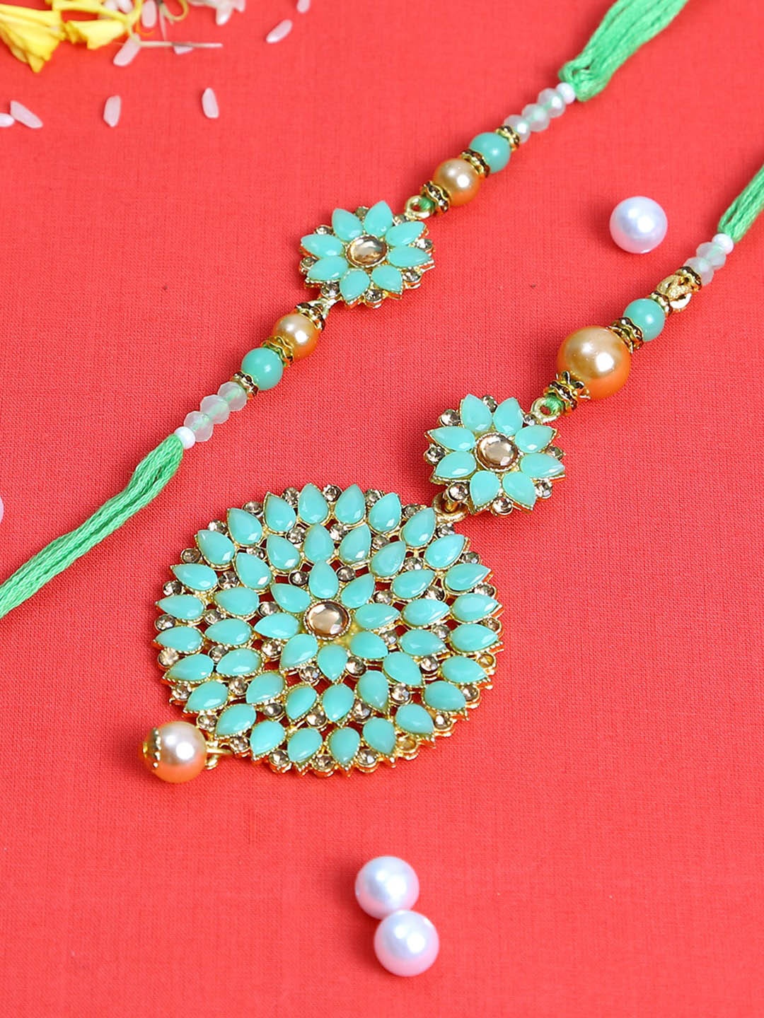 

Aapno Rajasthan Sea Green Kundan Bhaiya Bhabhi Rakhi Set
