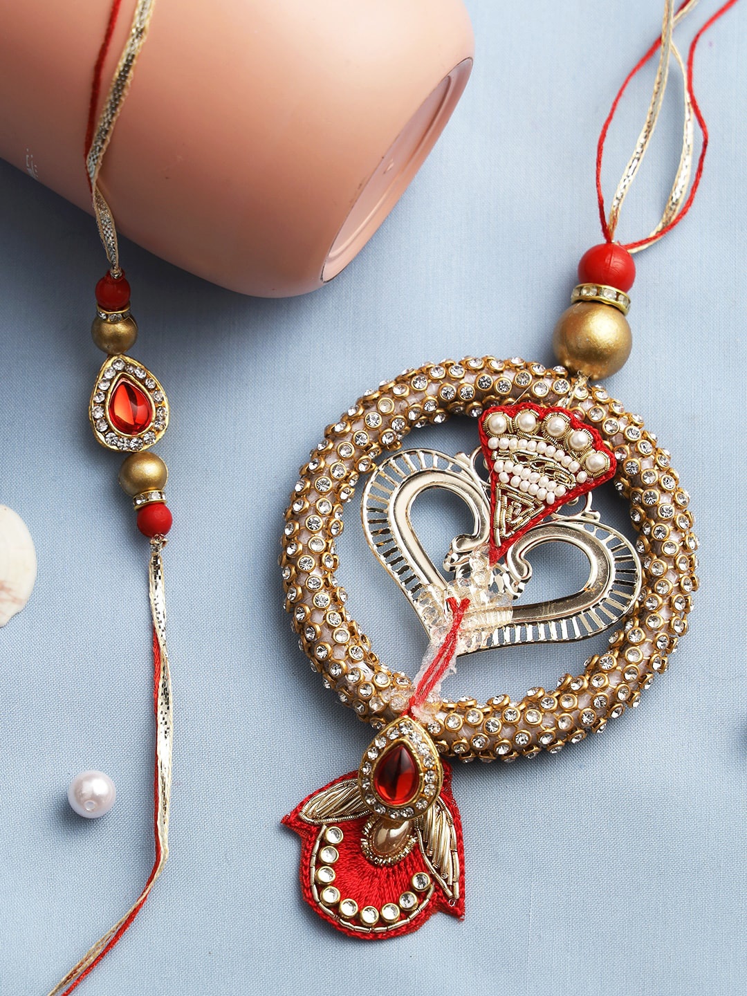 

Aapno Rajasthan Red & Gold-Toned Beaded Bhaiya Bhabhi Rakhi Gift Set