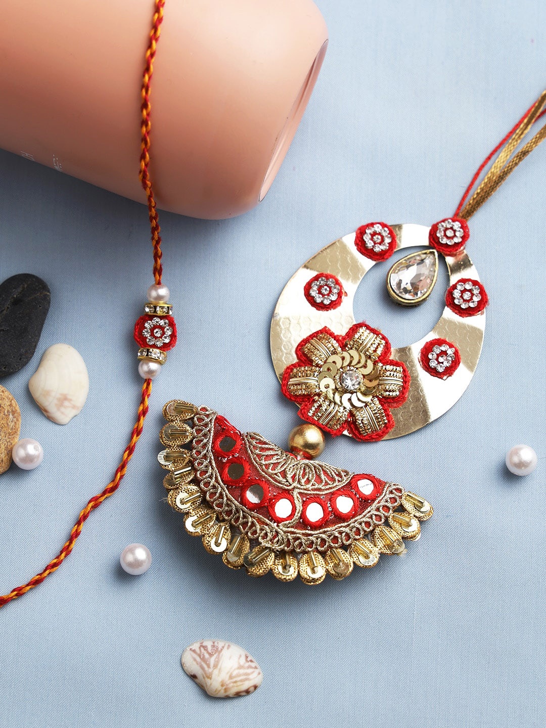 

Aapno Rajasthan Red & Gold Toned Beaded Bhaiya Bhabhi Rakhi Set
