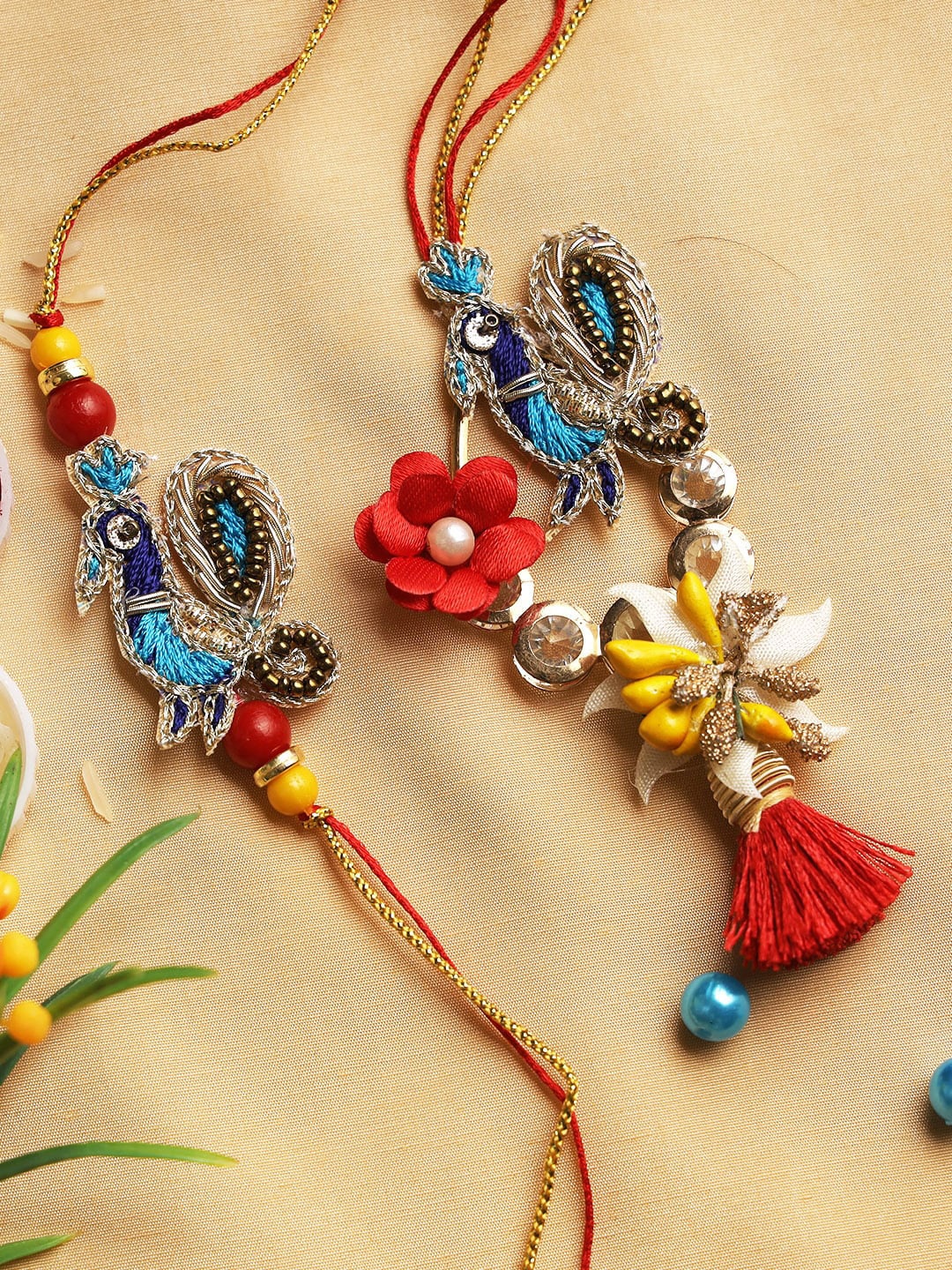 

Aapno Rajasthan Blue & Red Peacock Threadwork Traditional Bhaiya Bhabhi Rakhi Set with Box