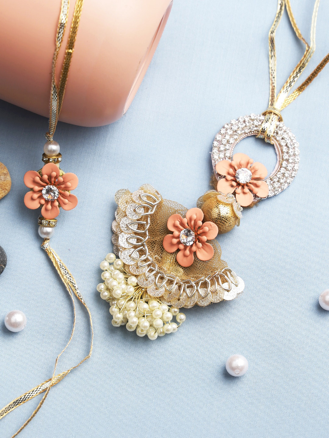 

Aapno Rajasthan Peach & Gold-Toned Sequinned Bhaiya Bhabhi Rakhi Combo Set