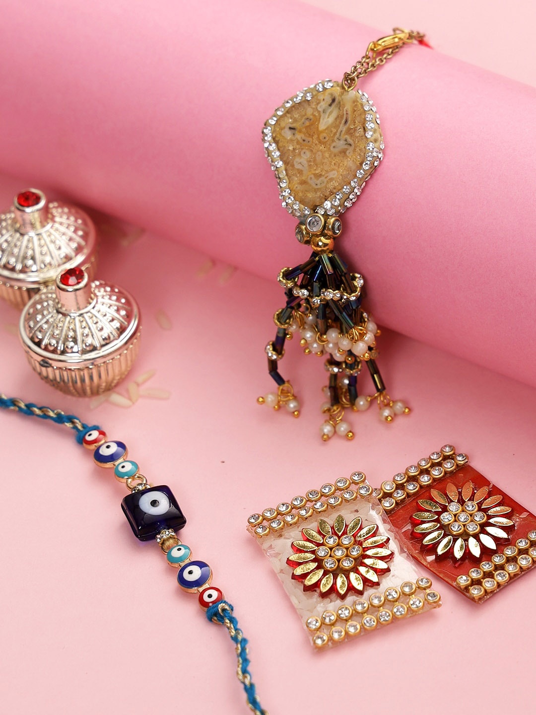 

Aapno Rajasthan Blue Evils Eye Bhaiya Bhabhi Rakhi Set