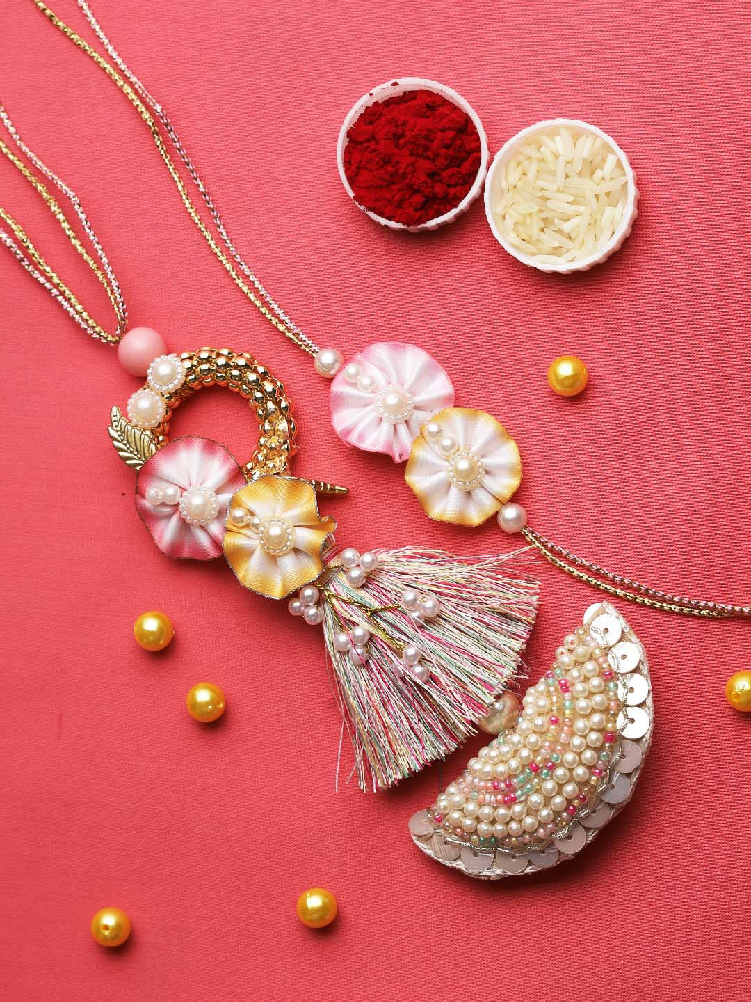 

Aapno Rajasthan Pink & Gold-Toned Flower Bhaiya Bhabhi Rakhi Gift Set
