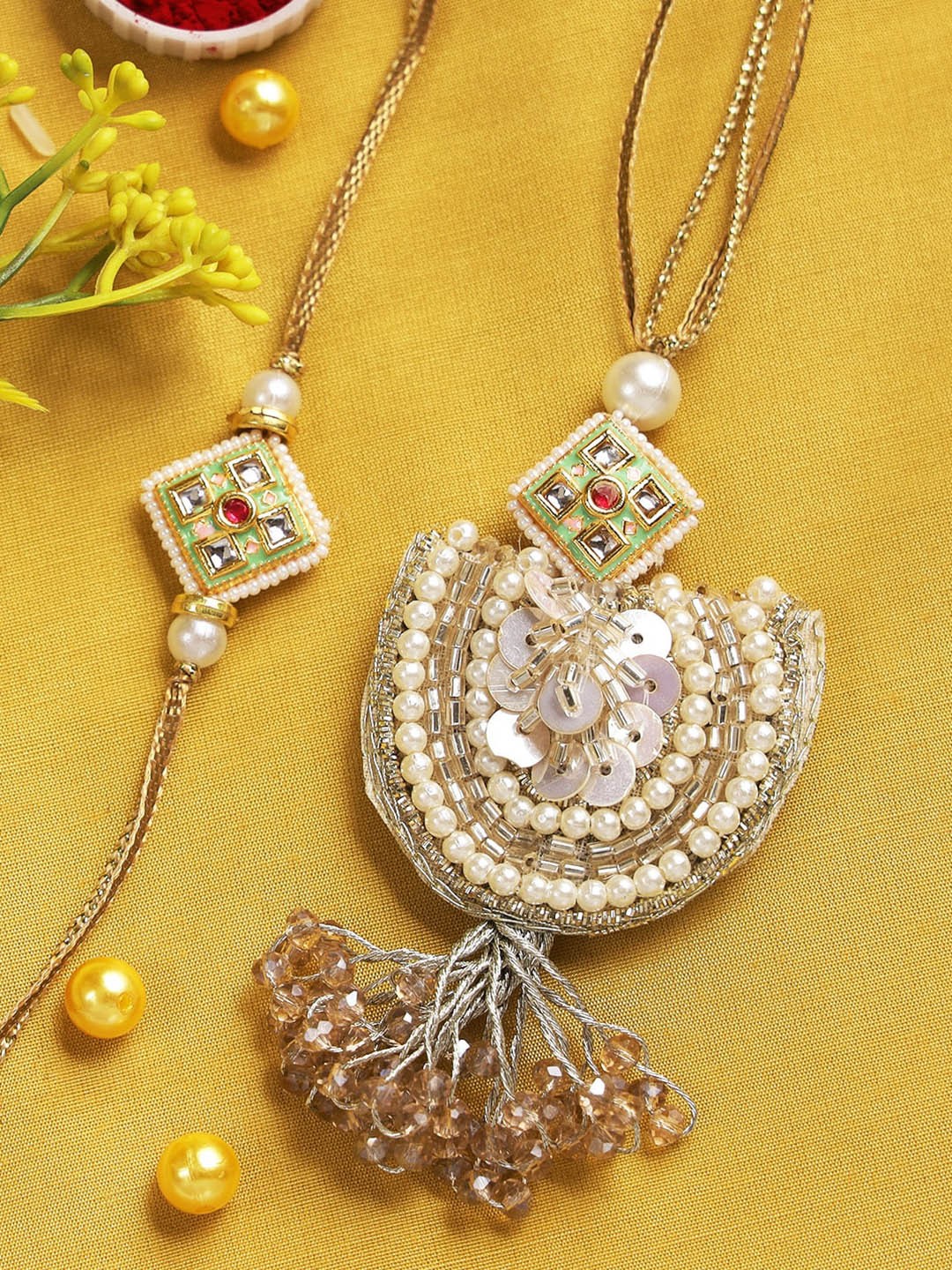 

Aapno Rajasthan unisex Beige Beaded Sequin Embellished Bhaiya Bhabhi Rakhi Set