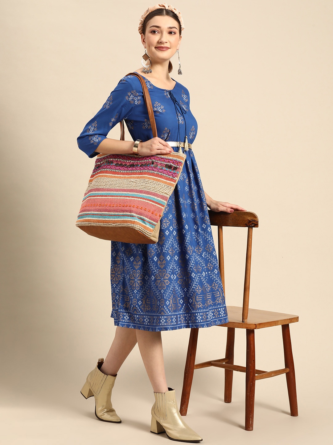 

Sangria Women Blue & Golden Printed Tie-Up Neck A-Line Dress