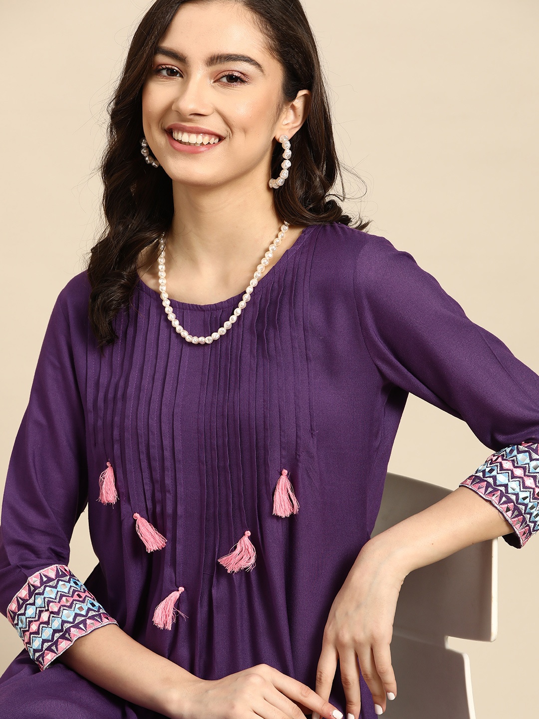 

Sangria Women Purple Pintucks Tasseled Mirror Work Kurta