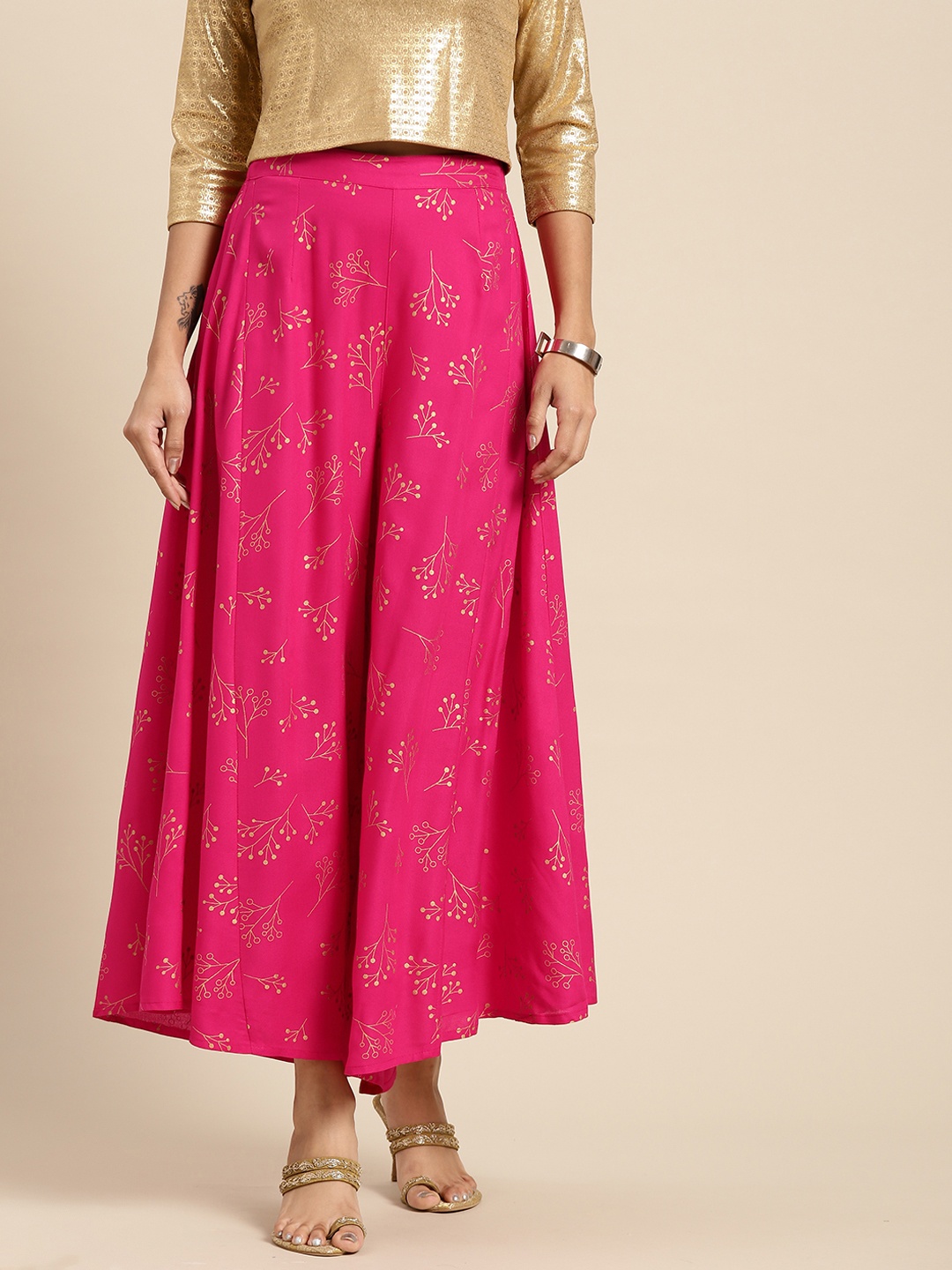

Sangria Women Pink & Golden Ethnic Motifs Printed Flared Palazzos