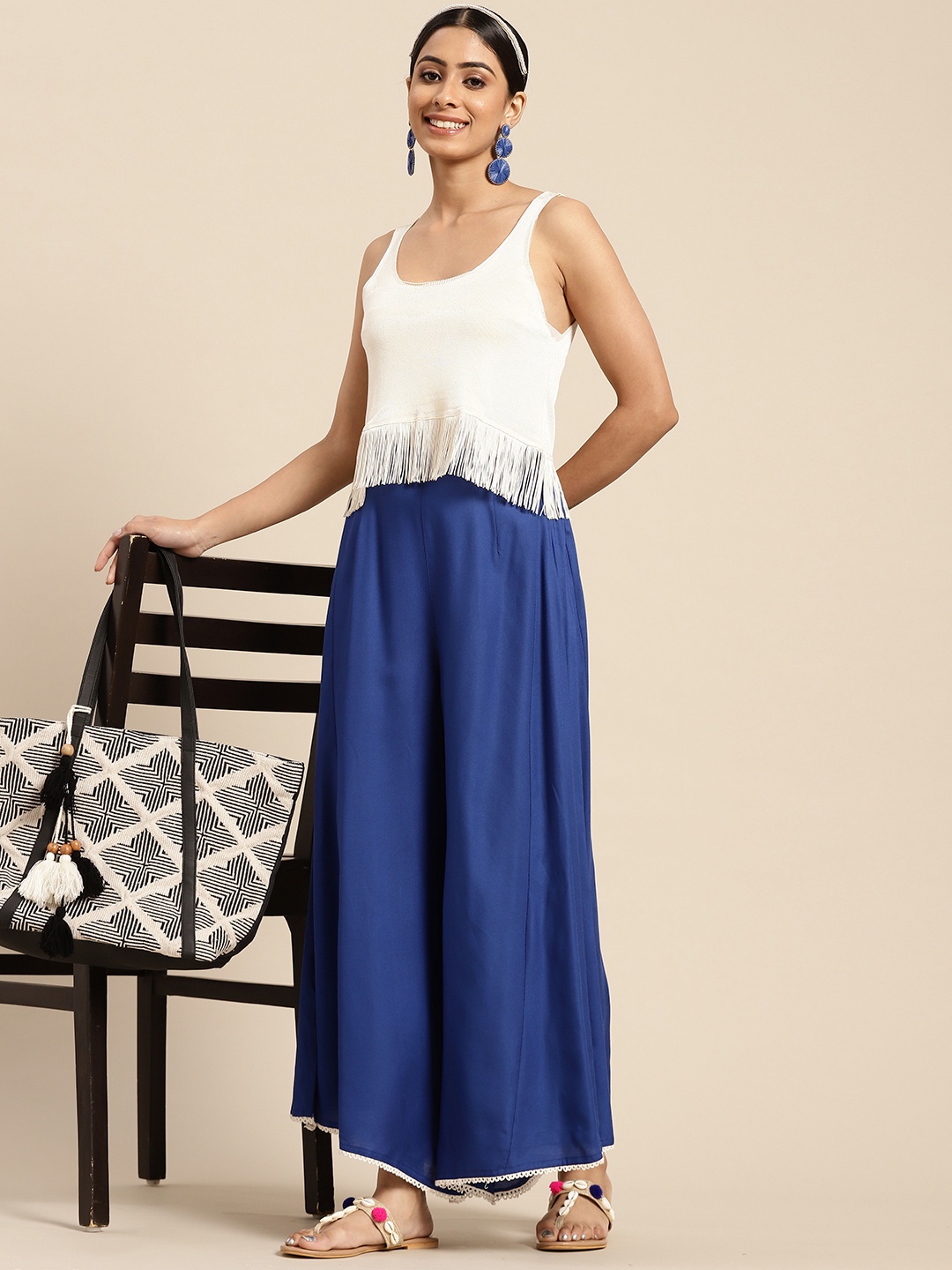 

Sangria Women Navy Blue Solid Flared Palazzos