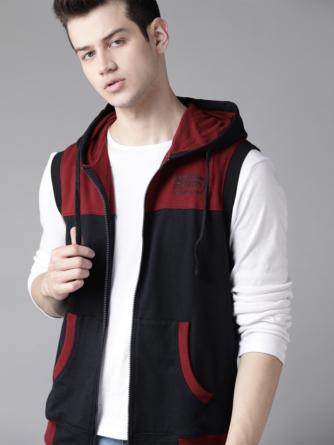 

Roadster Men Navy Blue & Maroon Colourblocked Sleeveless Hooded Sweatshirt