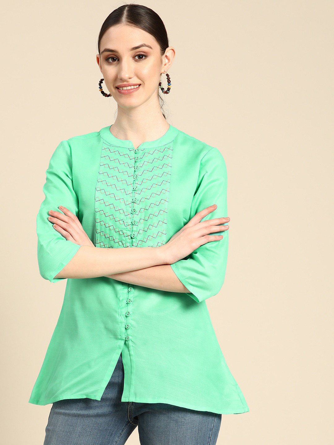 

Sangria Green Geometric Embroidered Mandarin Collar Ethnic Top