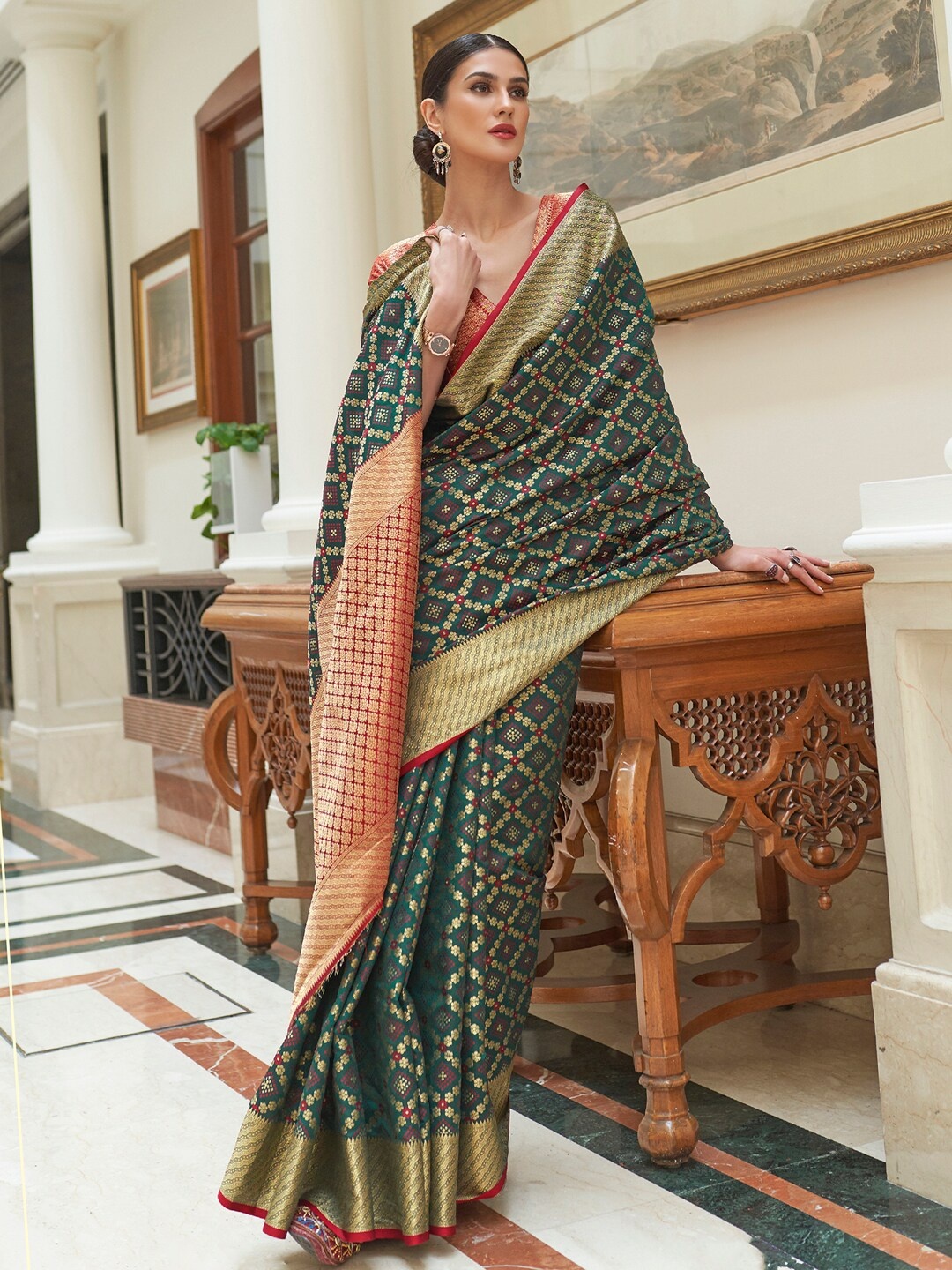 

Mitera Green & Red Woven Design Zari Silk Blend Patola Saree