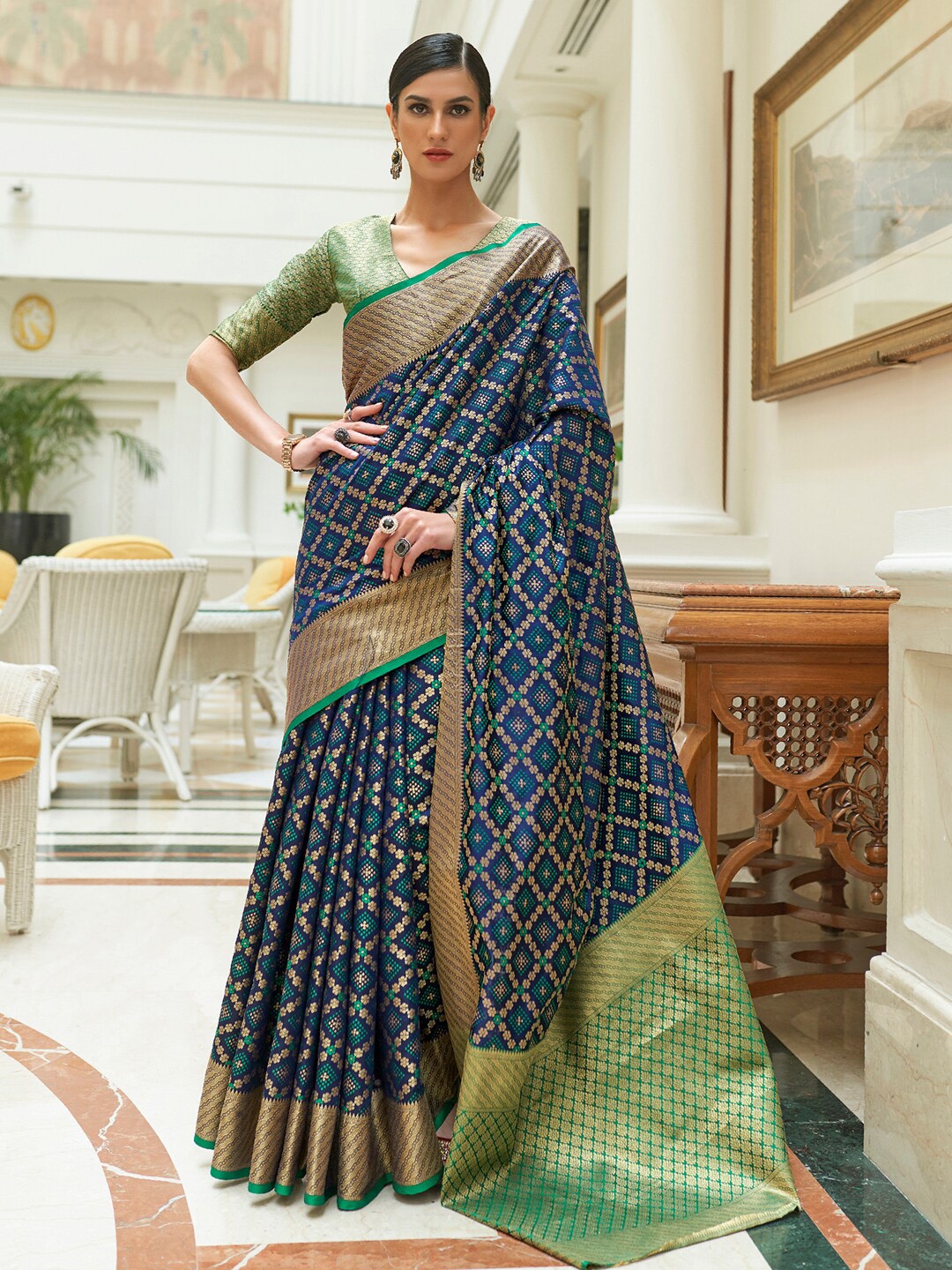 

Mitera Women Navy Blue & Green Woven Design Zari Silk Blend Patola Saree