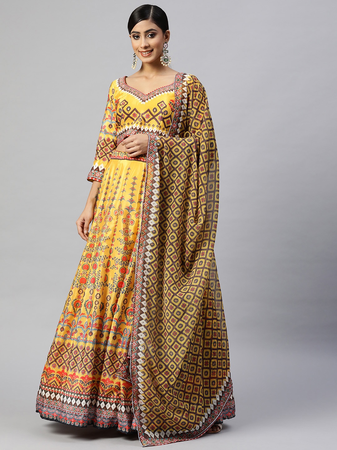 

Readiprint Fashions Yellow & Red Printed Stones Studded Semi-Stitched Lehenga Set