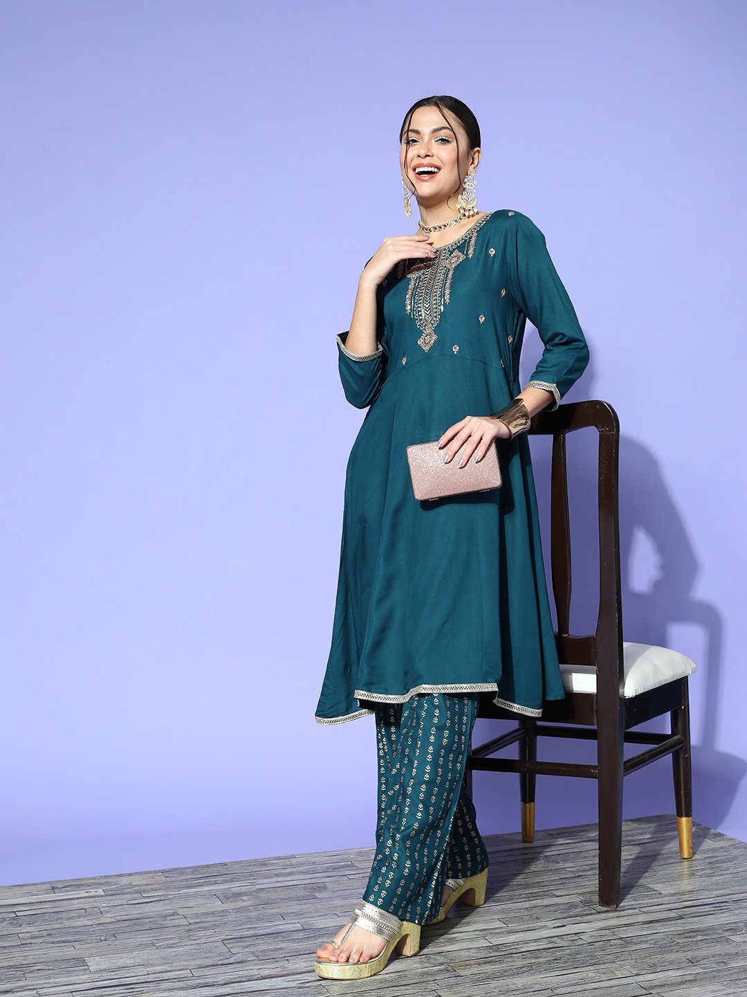 

Sangria Women Teal Blue & Gold-Toned Ethnic Motifs Yoke Design Panelled Kurta with Palazzos