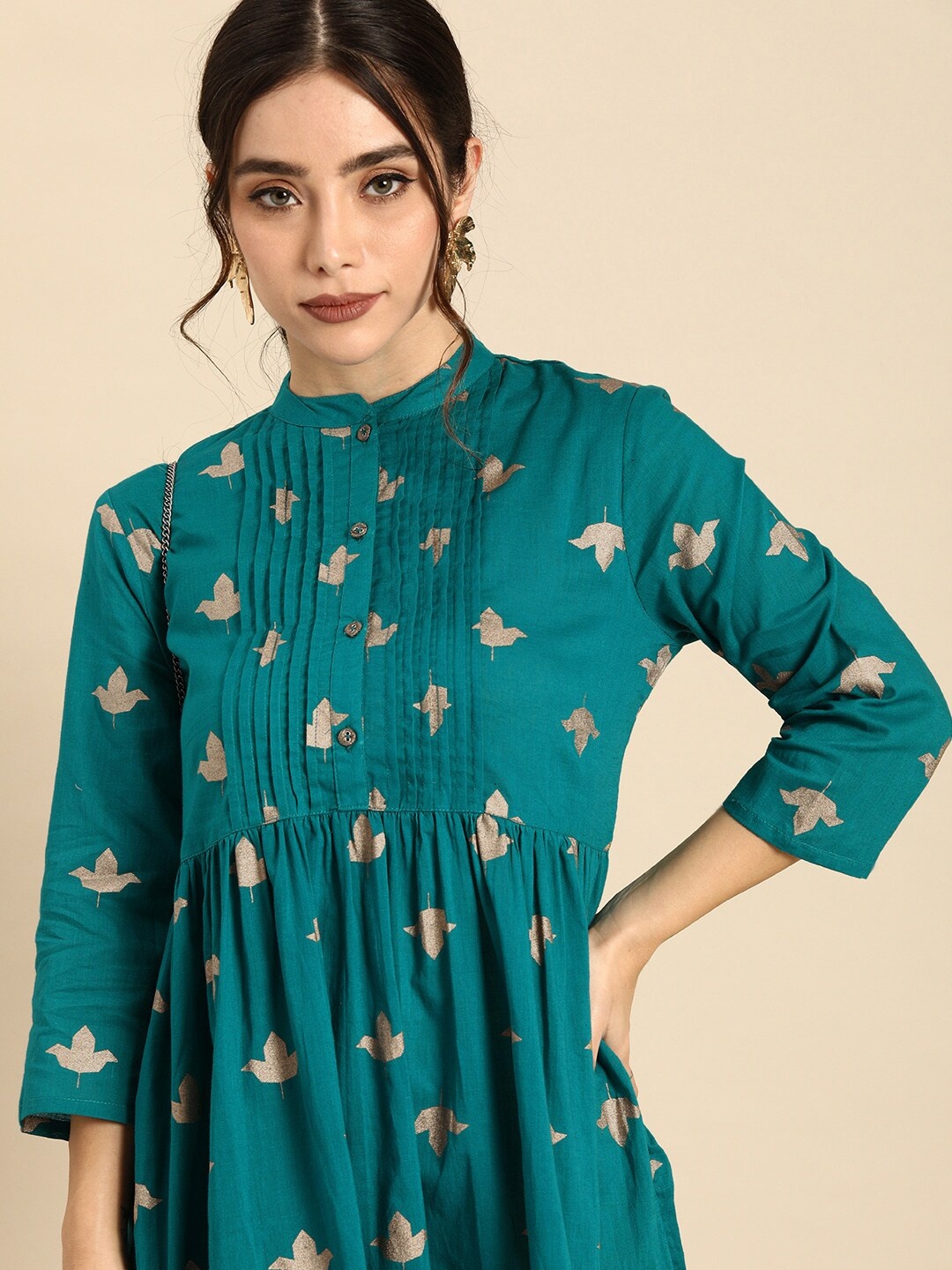 

Sangria Women Teal Green & Golden Pure Cotton Floral Print A-Line Ethnic Dress