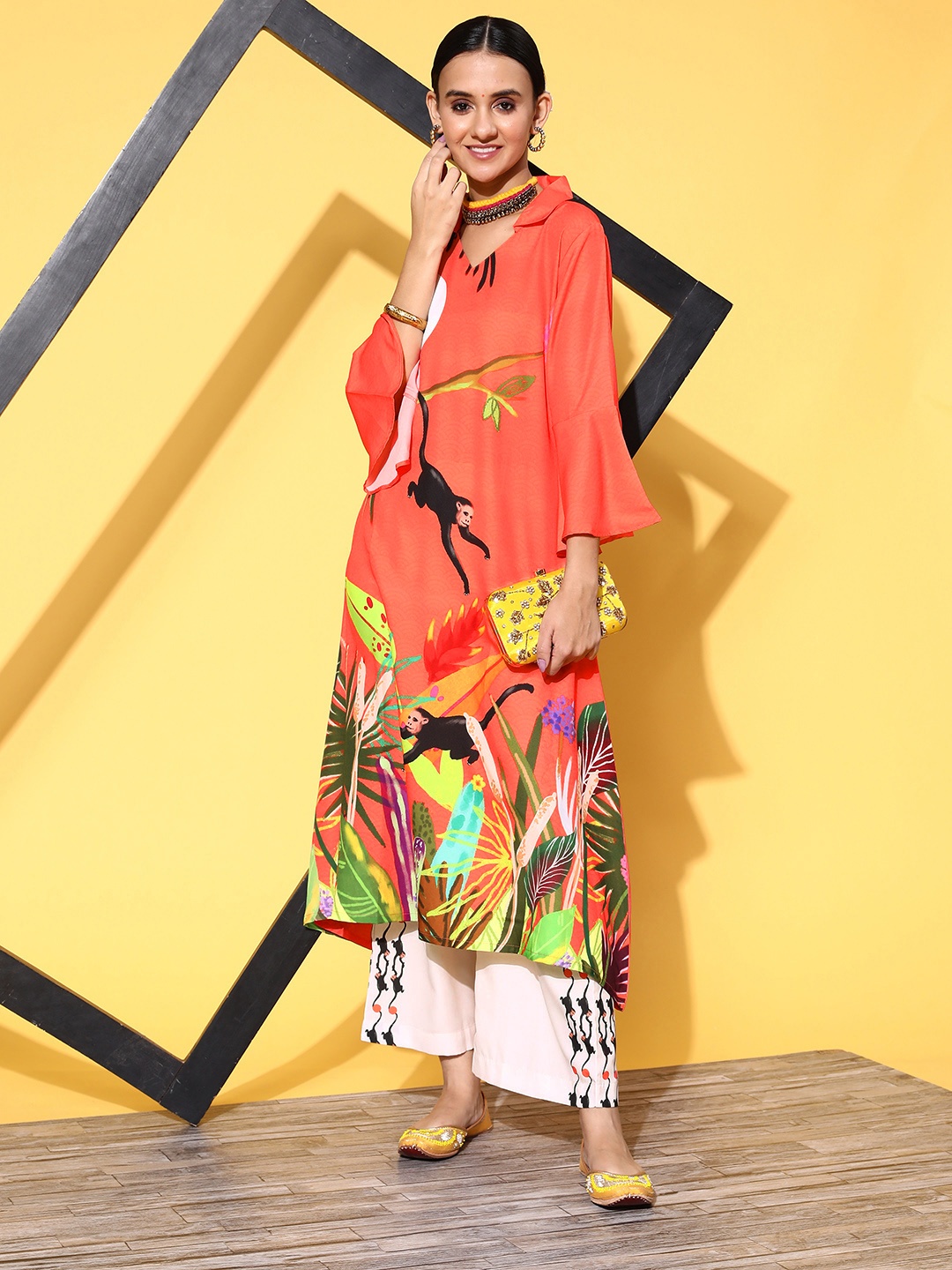 

Sangria Women Tangy Orange Ethnic Motifs Printed Asymmetrical Kurta with Palazzos