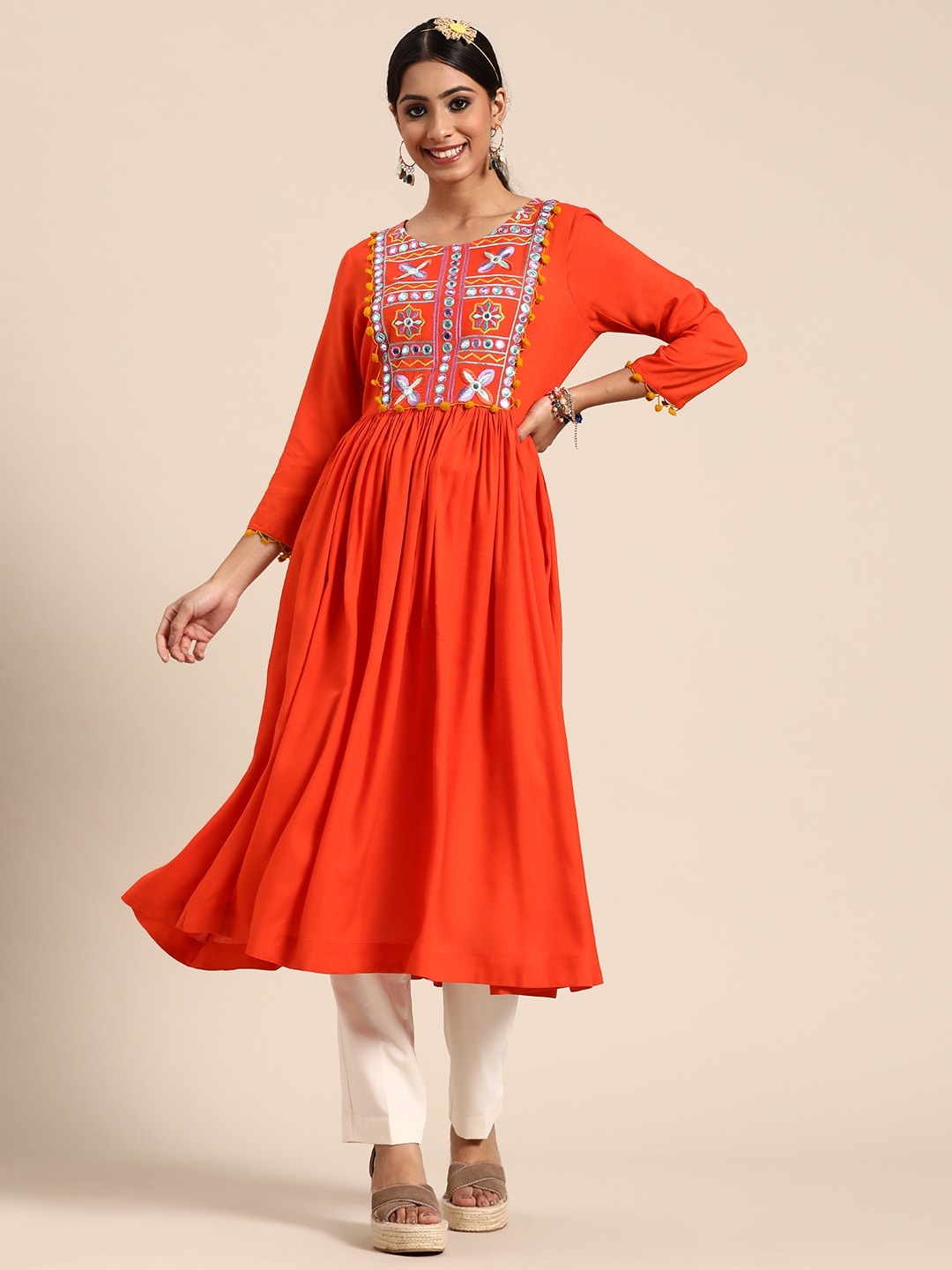 

Sangria Women Rust Orange Ethnic Motifs Embroidered Yoke Design Mirror Work Kurta