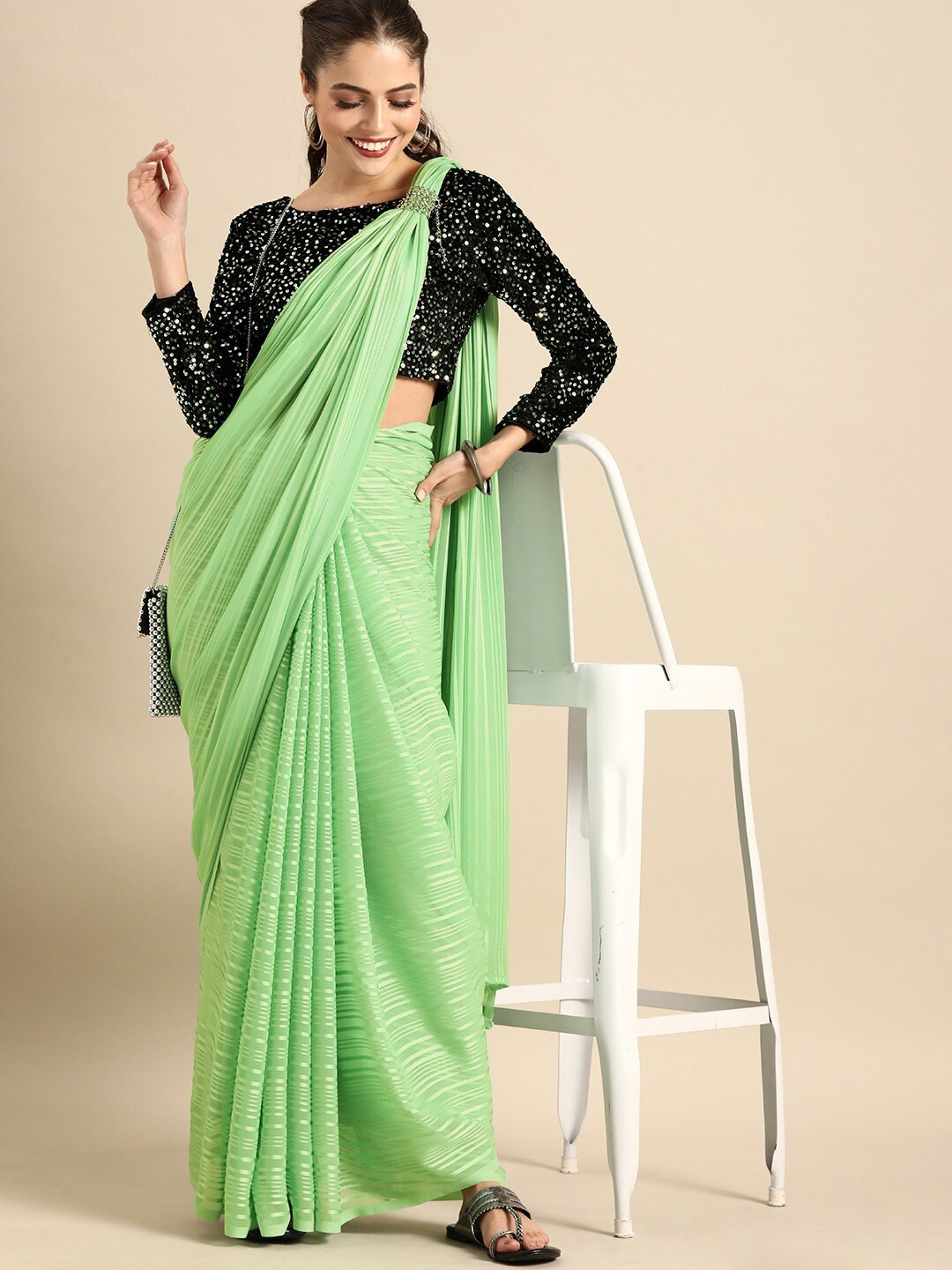 

Sangria Green & Black Striped Sequinned Silk Blend Designer Saree