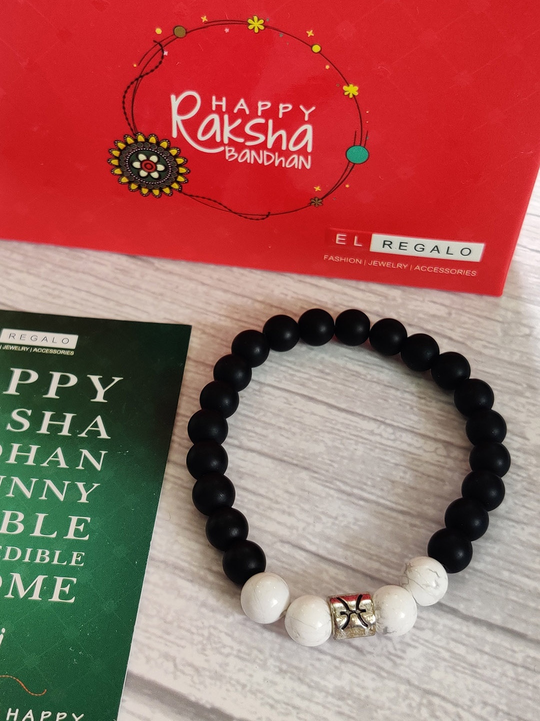 

EL REGALO White & Black Pisces Beads Bracelet Rakhi