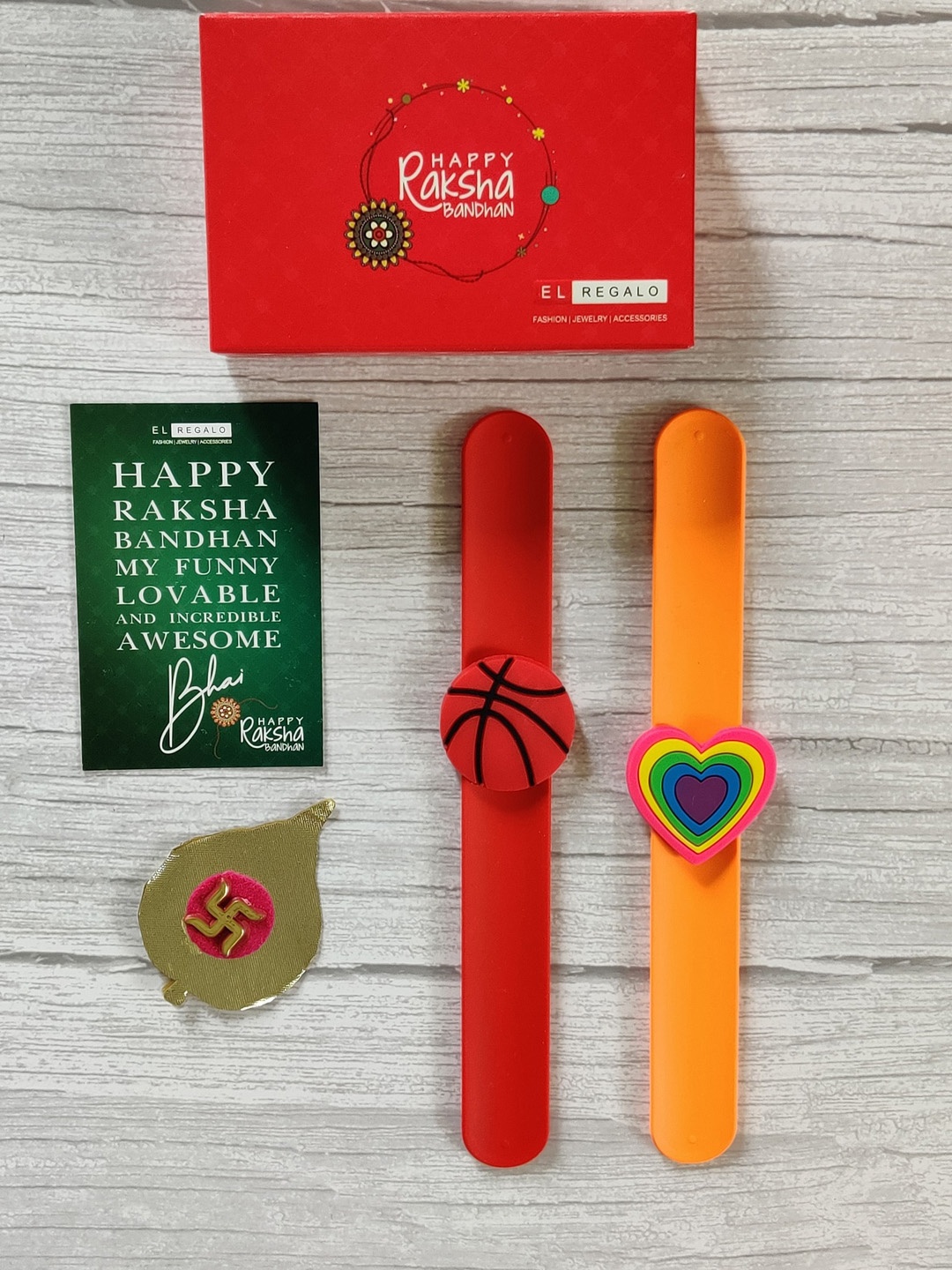 

EL REGALO Kids Set Of 2 Red Orange Embedded Rakhi Combo with Card & Roli Chawal