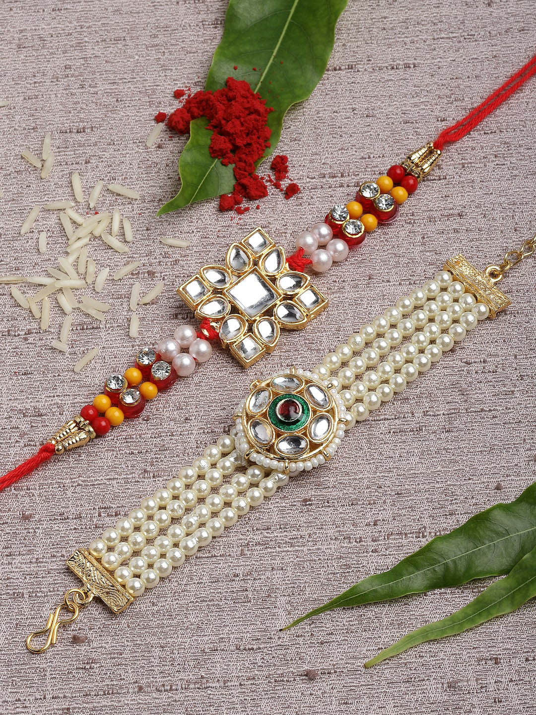 

PANASH Set of 2 Gold-Plated Kundan Bhaiya Bhabhi Embellished Rakhi with Roli Chawal