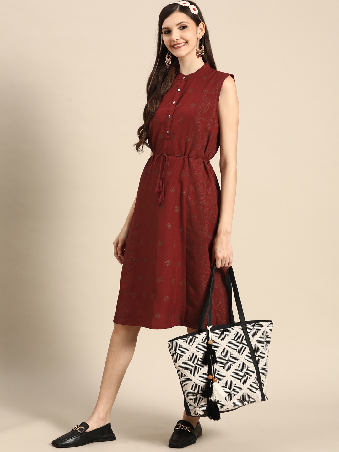

Sangria Women Maroon & Golden Ethnic Motifs Printed A-Line Dress