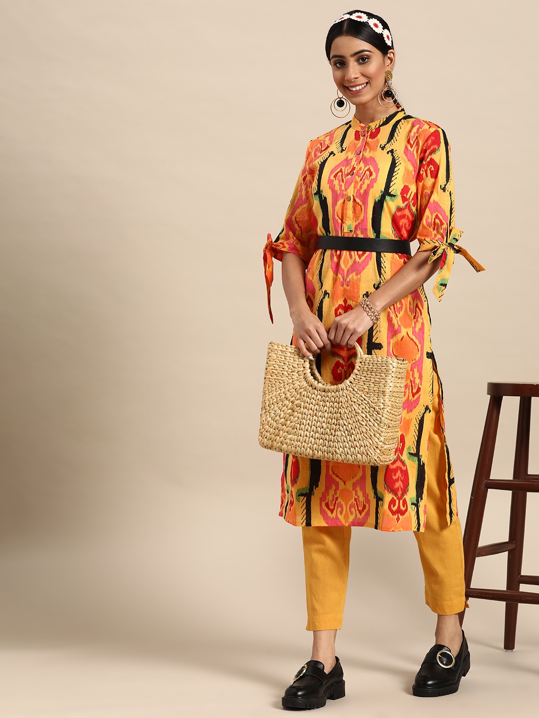

Sangria Women Ikat Printed Pure Cotton Kurta with Trousers, Mustard