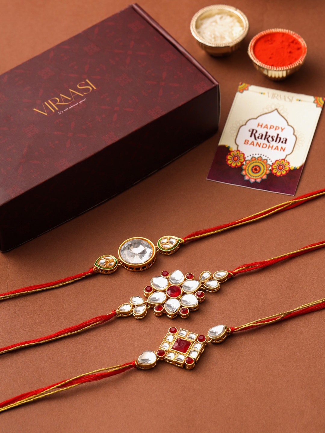 

VIRAASI Men Set of 3 Gold-Toned & Red Kundan Studded Rakhi