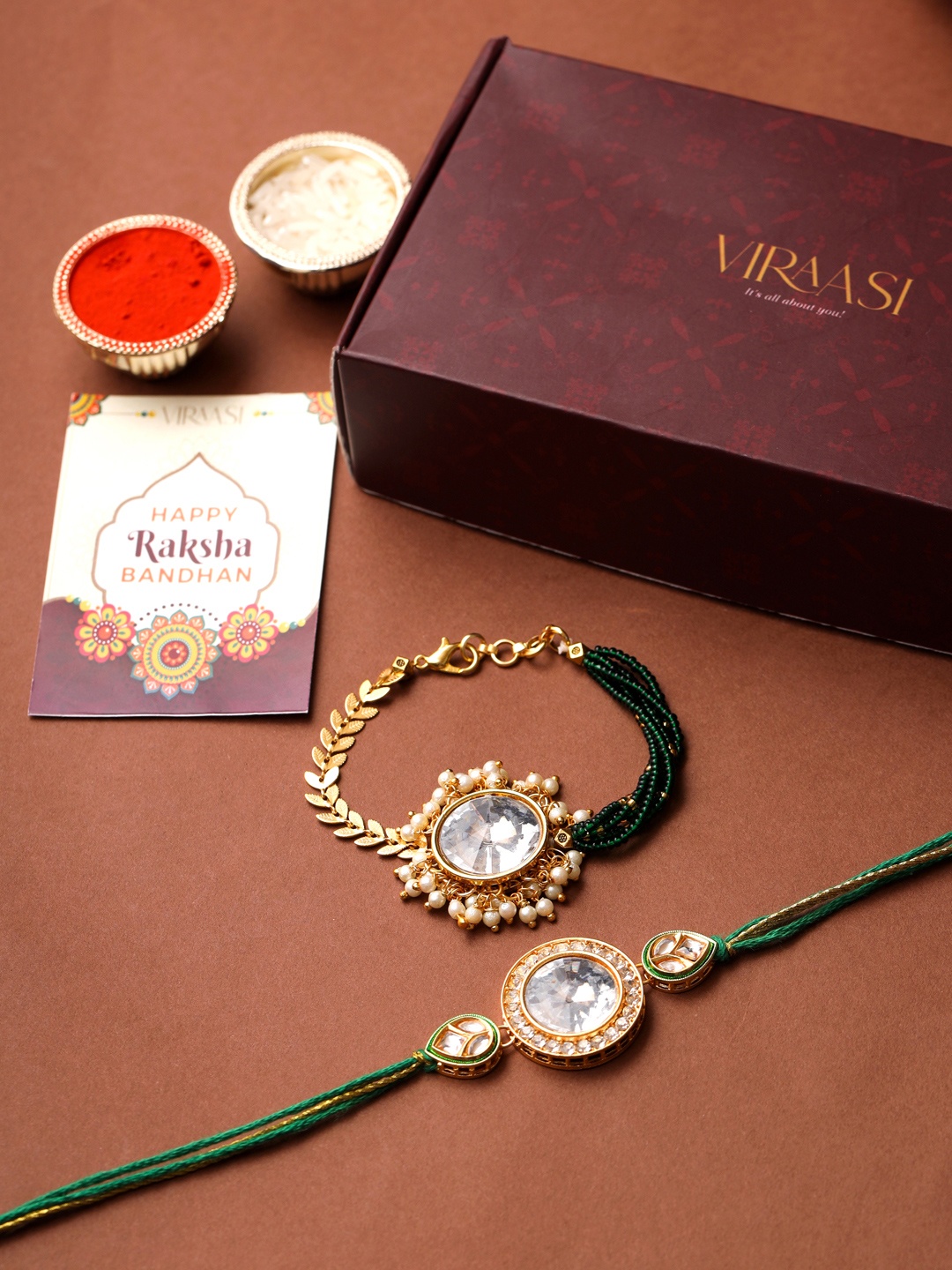 

VIRAASI Set Of 2 Gold-Toned & Green Stone-Studded Rakhi & Lumba With Roli Chawal & Greeting Card